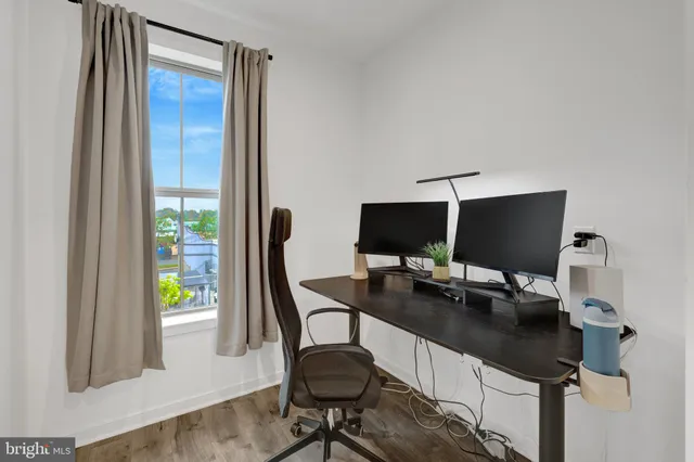 a spacious bedroom with a bed and a window