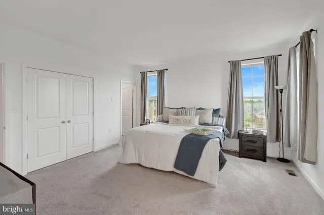 a bathroom with a double vanity sink and mirror