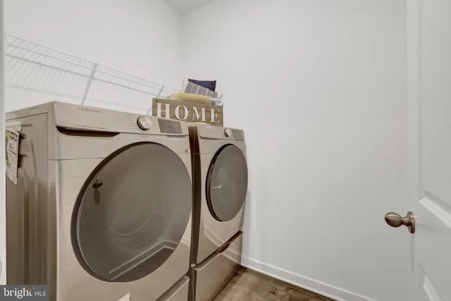 a bedroom with a bed next to a window