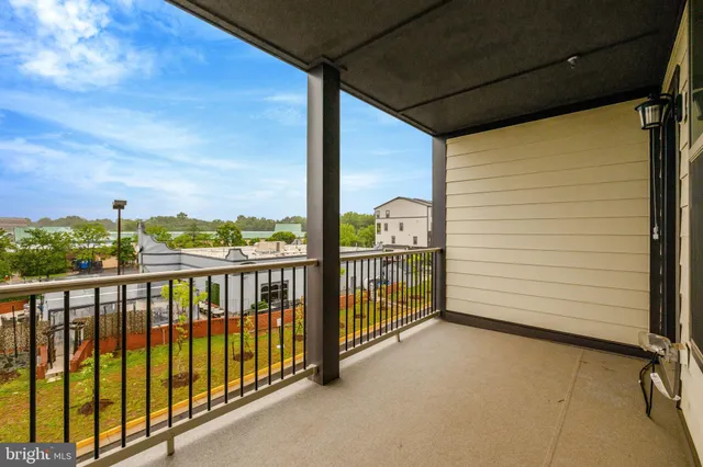 a car parked in front of a white house