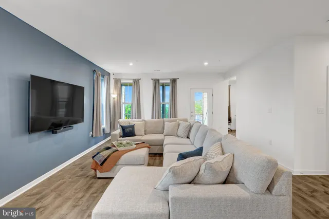 a kitchen with a refrigerator a sink and a stove top oven