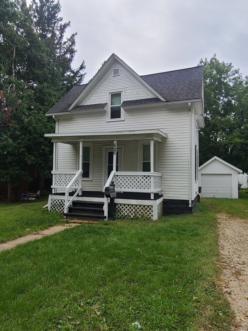 606 South 3rd Street Rochelle, IL 61068 - Photo 1 of 18 a front view of a house with a garden and yard