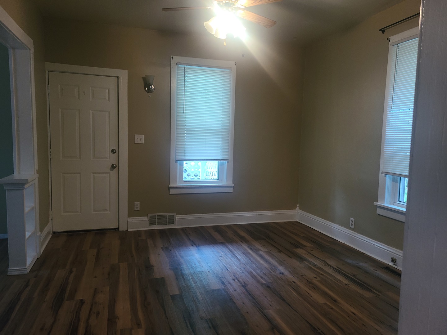 606 South 3rd Street Rochelle, IL 61068 - Photo 10 of 18 wooden floor in an empty room with a window