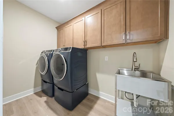 a utility room with cabinets