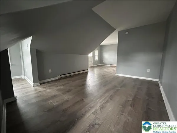 a view of livingroom and an empty room