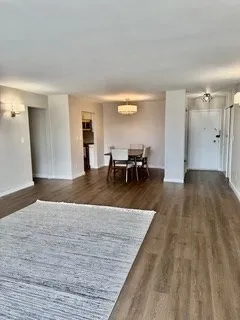 a view of a living room and dining room