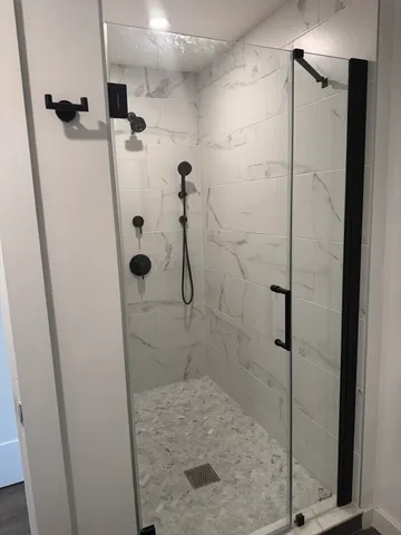 a bathroom with a sink and mirror with toilet