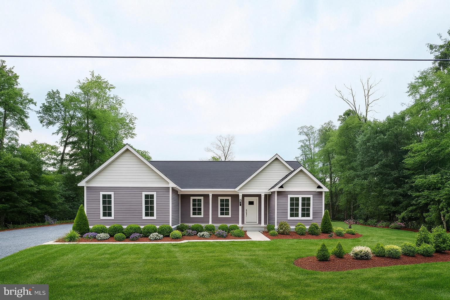 a front view of a house with a garden and plants
