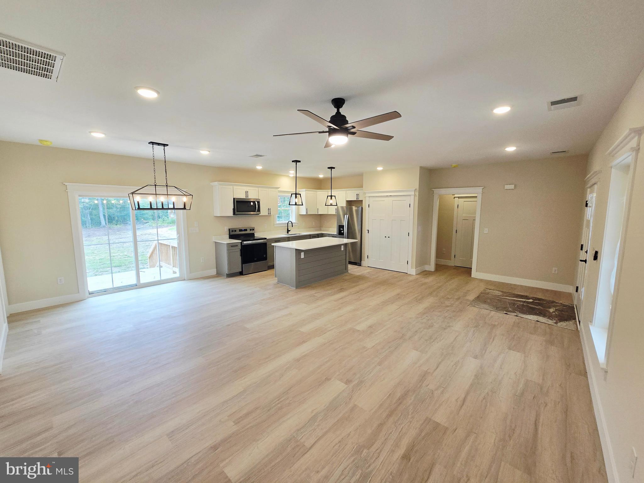 26707 Shortly Road Georgetown, DE 19947 - Photo 12 of 35 a view of a kitchen with a sink and a refrigerator