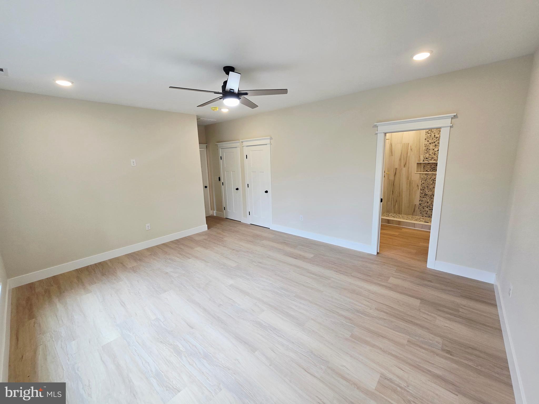 26707 Shortly Road Georgetown, DE 19947 - Photo 16 of 35 wooden floor in an empty room with a window