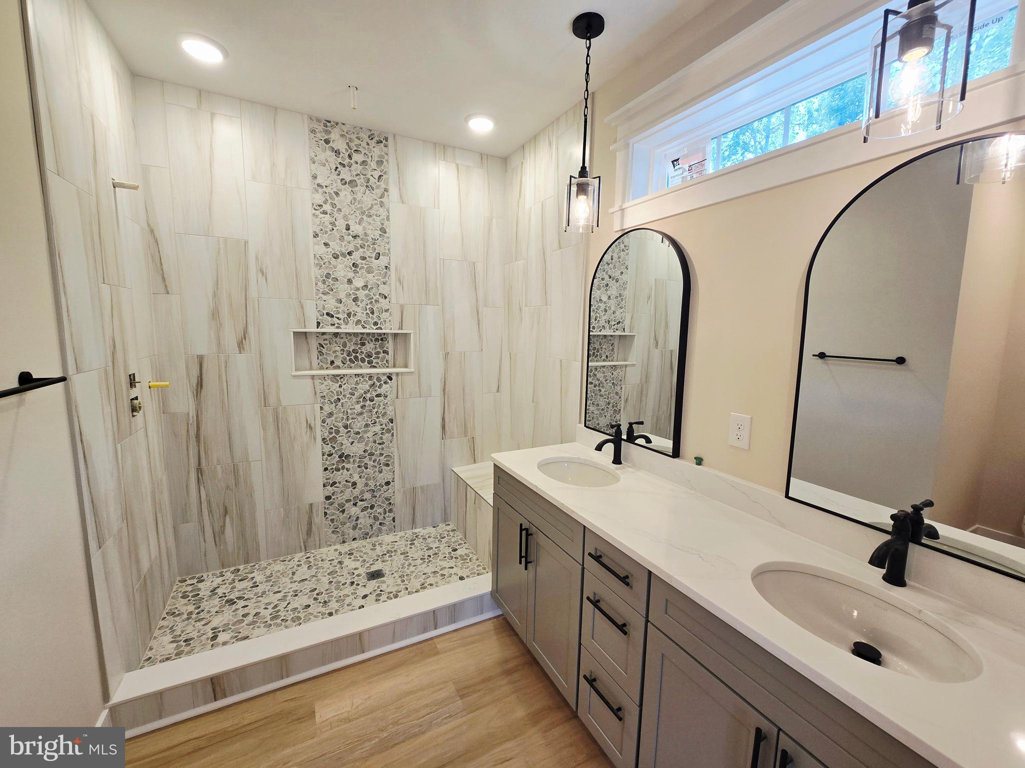 26707 Shortly Road Georgetown, DE 19947 - Photo 17 of 35 a bathroom with double vanity sink and a mirror