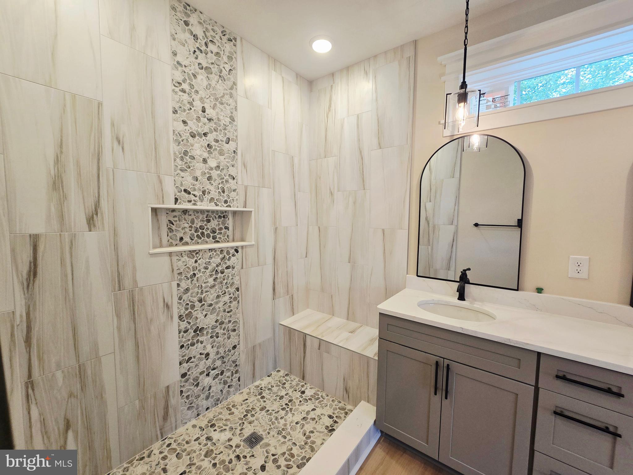 26707 Shortly Road Georgetown, DE 19947 - Photo 18 of 35 a bathroom with a sink a vanity and a mirror