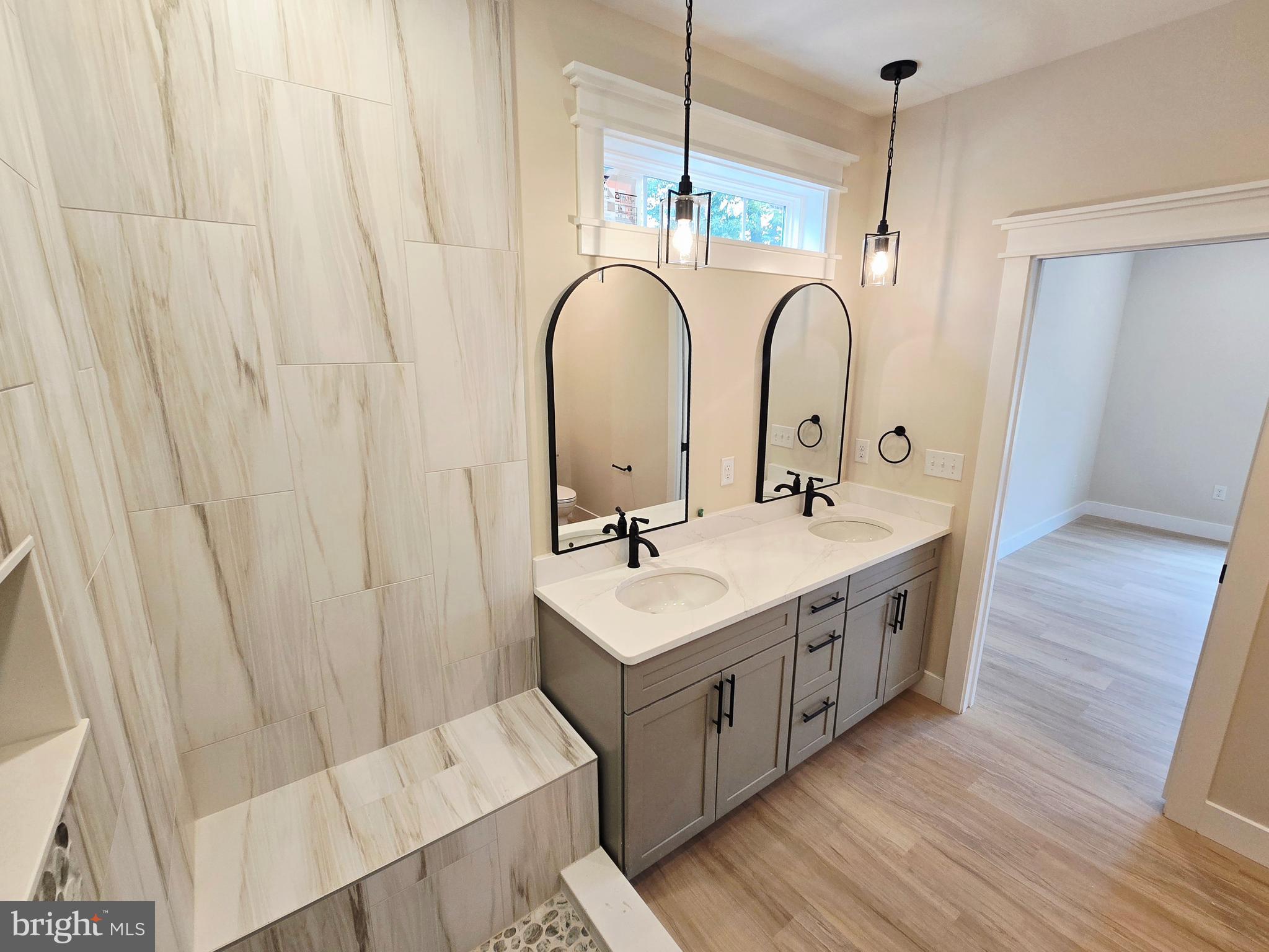 26707 Shortly Road Georgetown, DE 19947 - Photo 19 of 35 a bathroom with a sink and a mirror