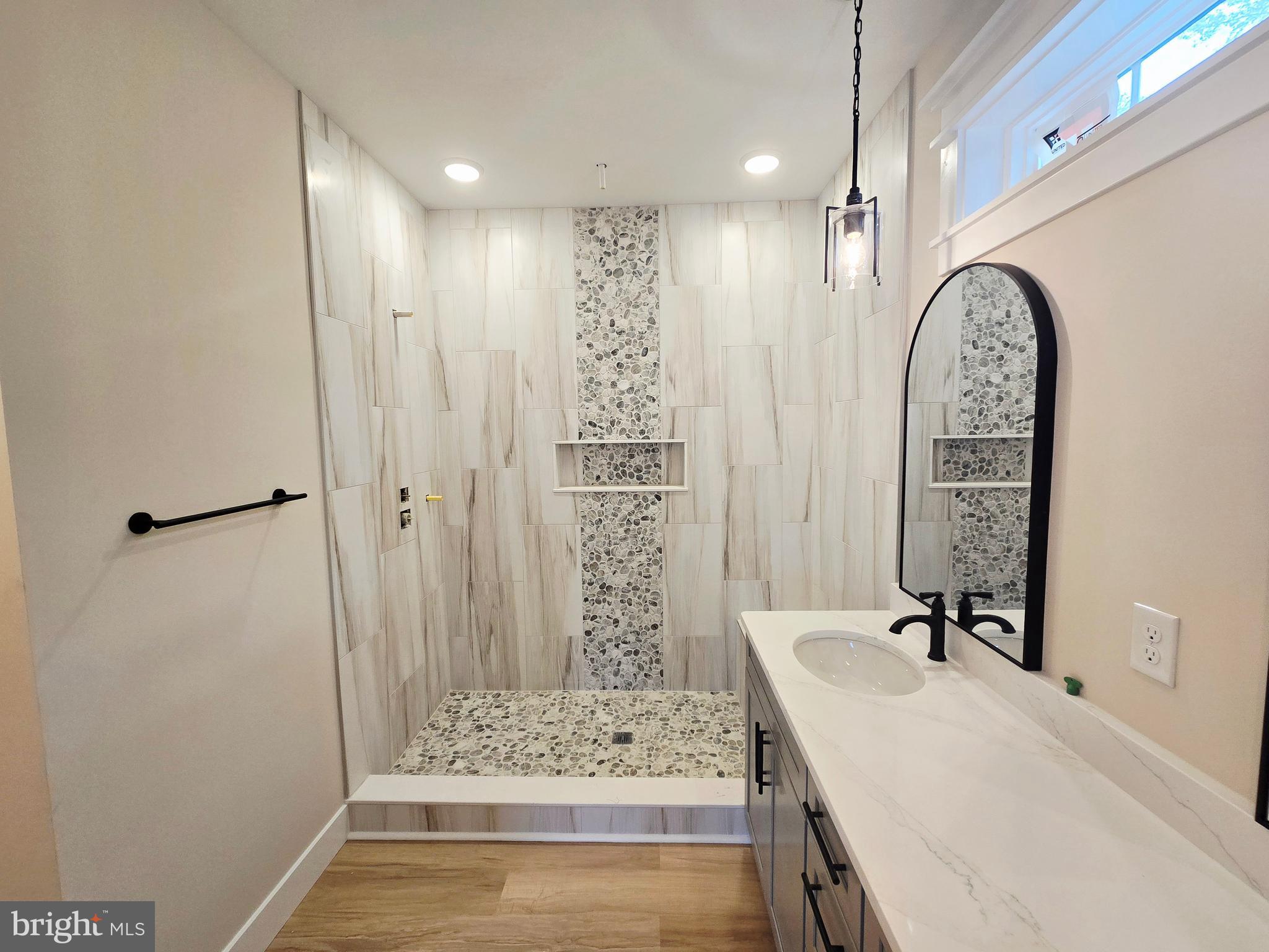 26707 Shortly Road Georgetown, DE 19947 - Photo 20 of 35 a bathroom with a bathtub sink and mirror