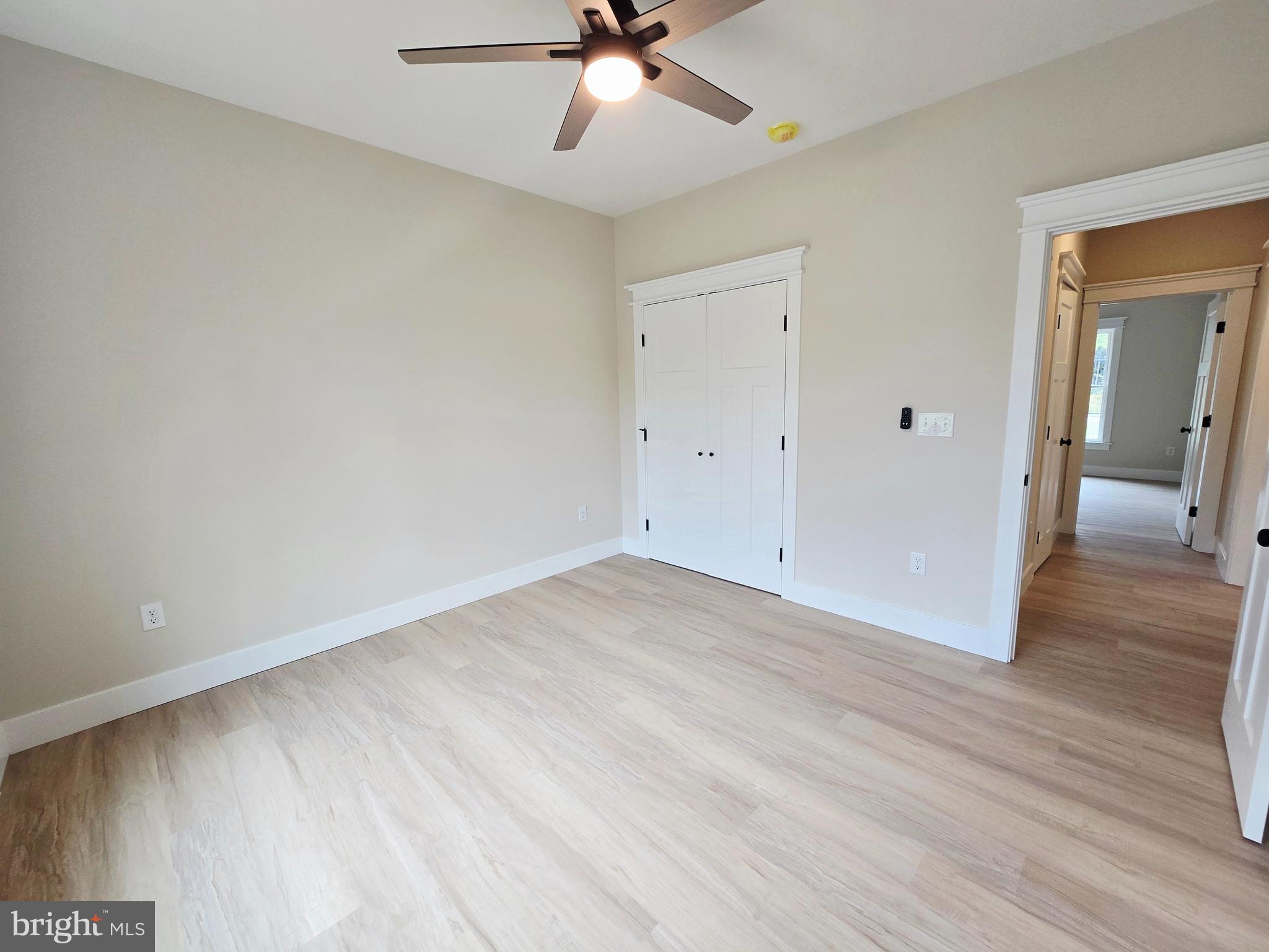 26707 Shortly Road Georgetown, DE 19947 - Photo 23 of 35 wooden floor in an empty room with a window