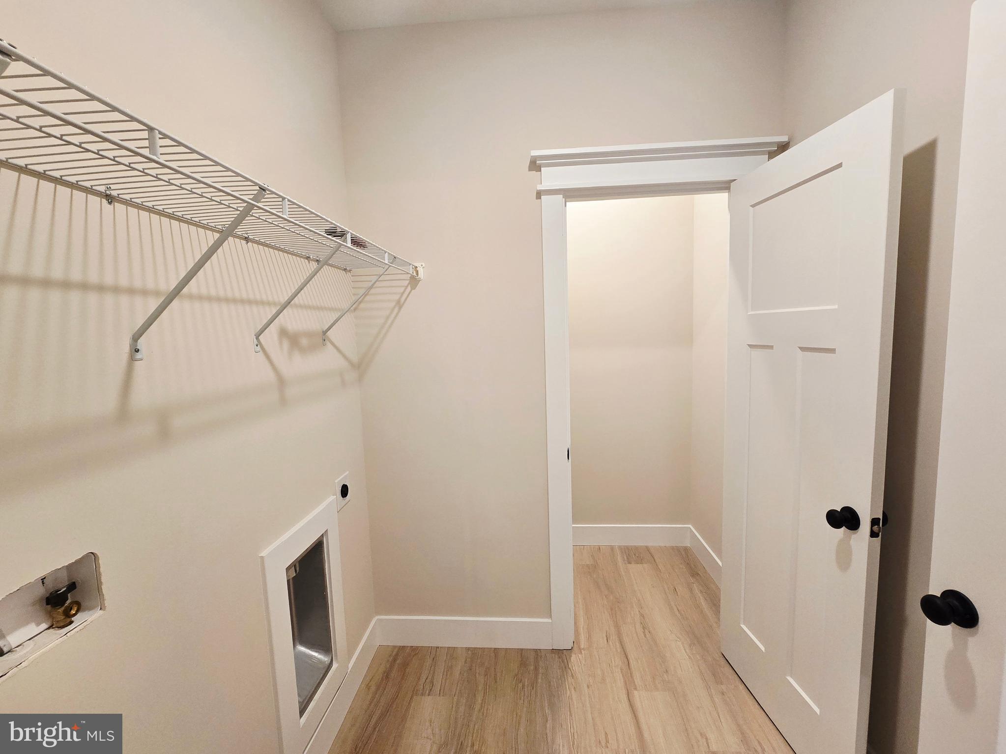 26707 Shortly Road Georgetown, DE 19947 - Photo 28 of 35 a view of a room that has wooden floor and white walls