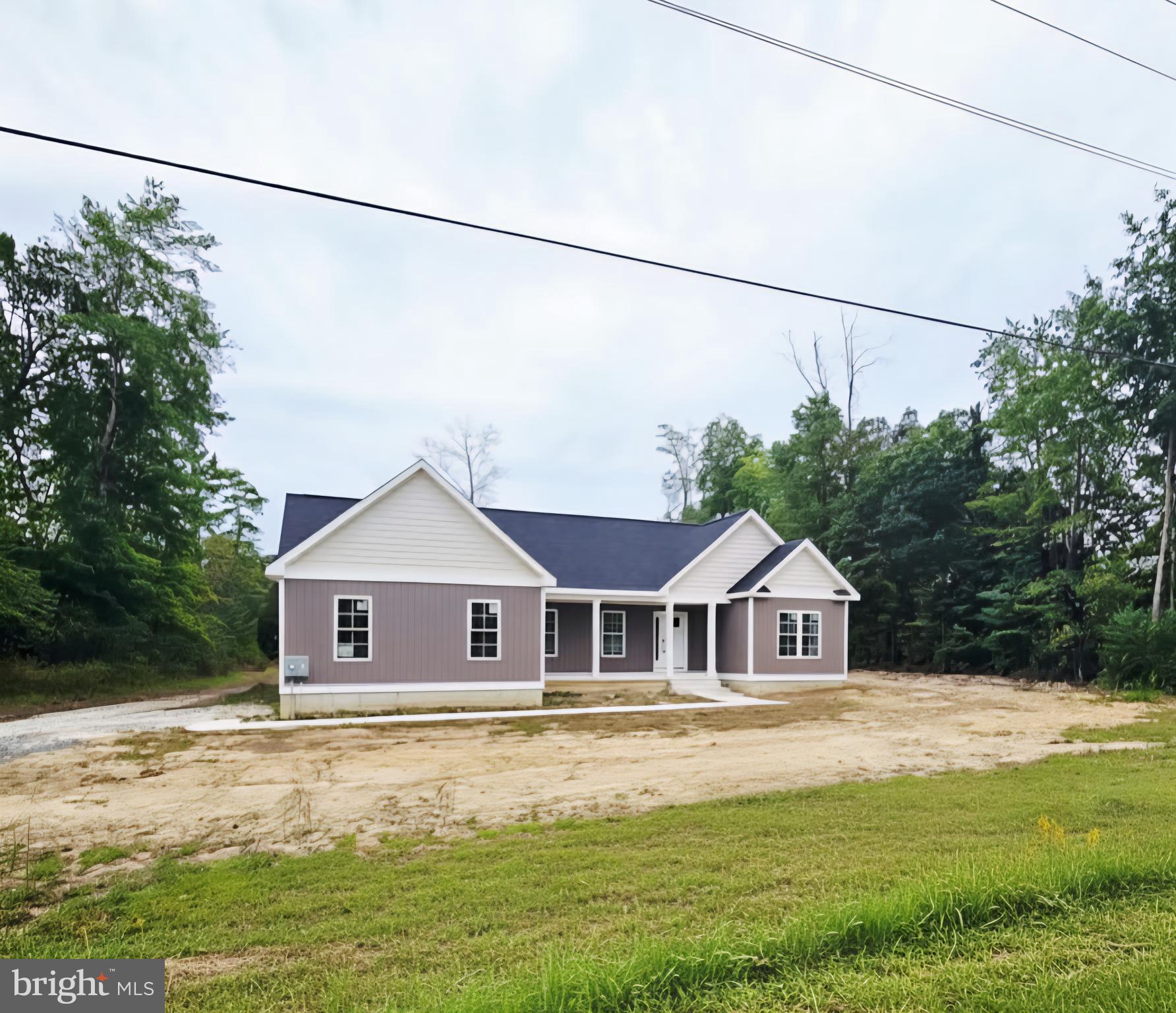 26707 Shortly Road Georgetown, DE 19947 - Photo 34 of 35 a front view of a house with a yard
