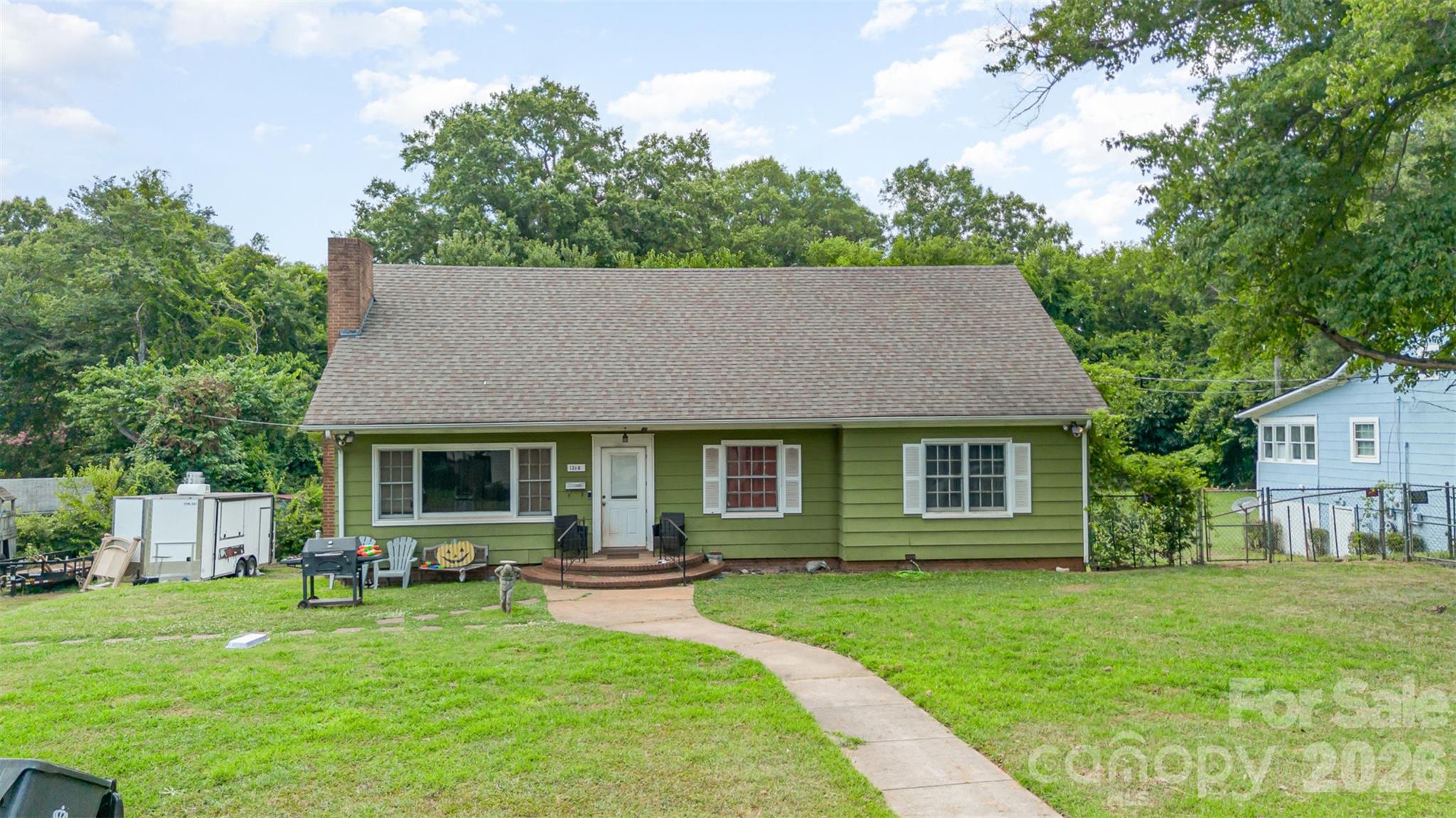 1318 Enderly Road, Unit 1B Charlotte, NC 28208 - Photo 2 of 5 a house view with a garden space