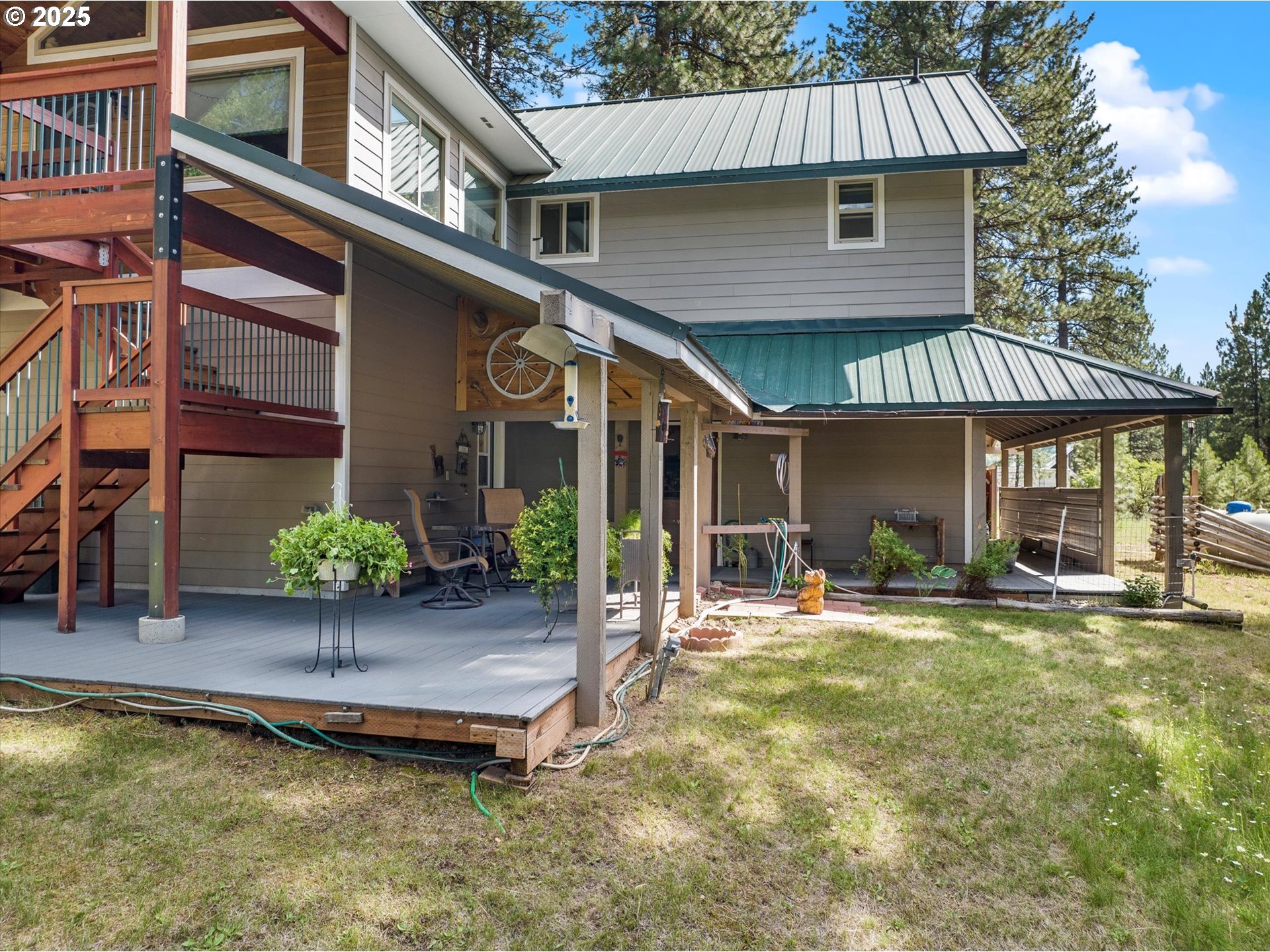 395 Bonanza Street Sumpter, OR 97877 - Photo 11 of 39 a view of a house with a patio and a yard