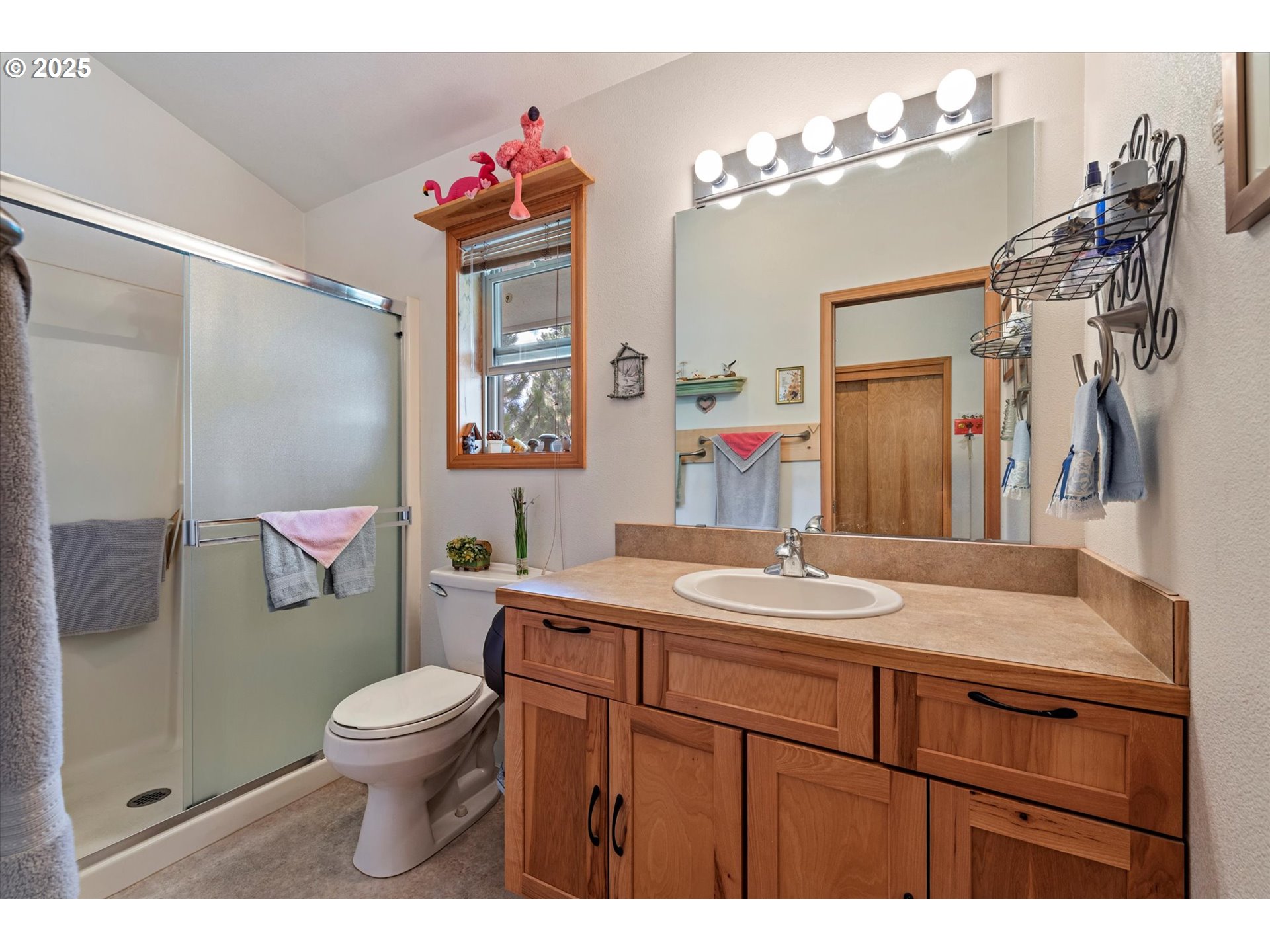 395 Bonanza Street Sumpter, OR 97877 - Photo 25 of 39 a bathroom with a sink vanity mirror and toilet