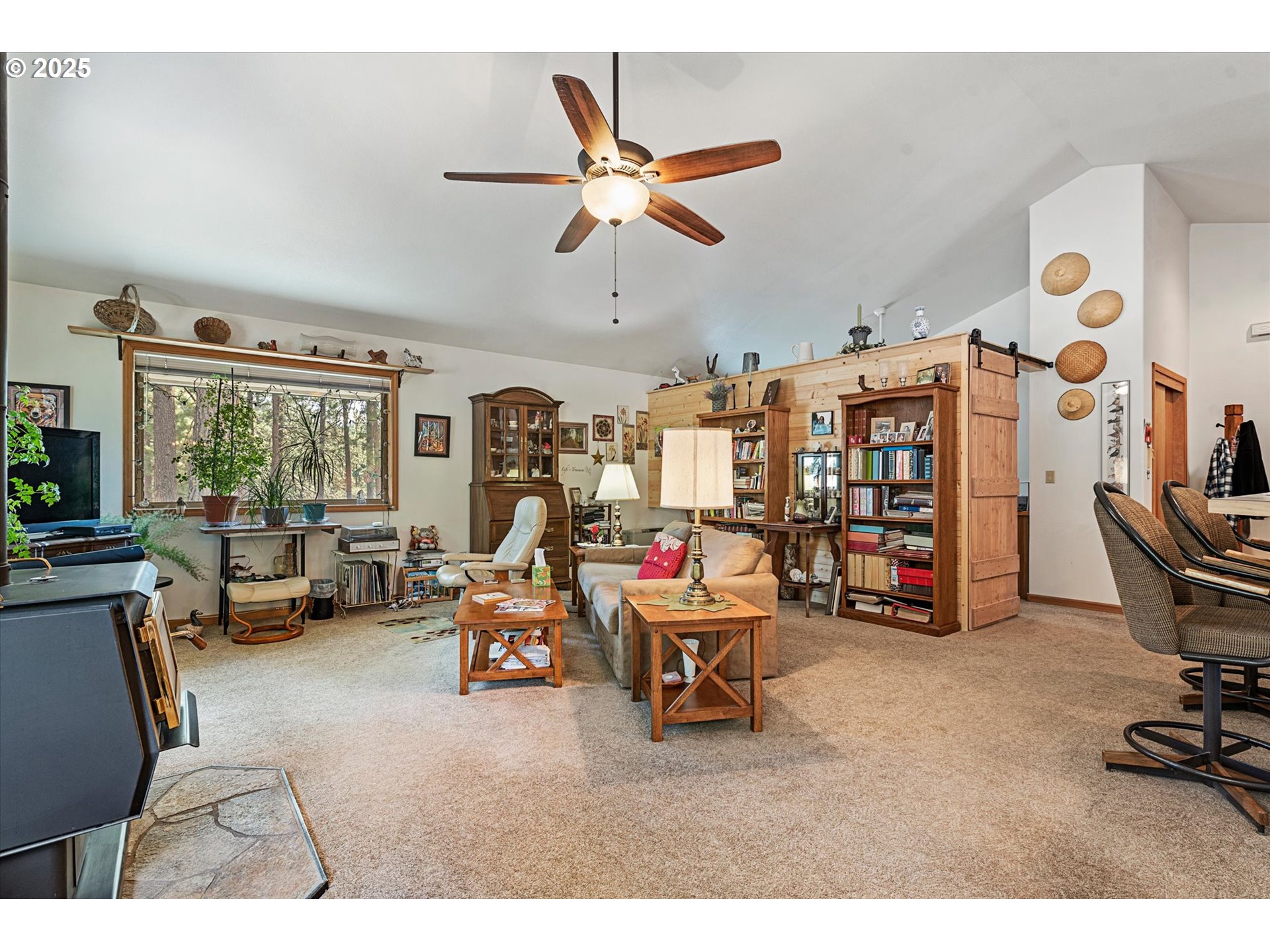 395 Bonanza Street Sumpter, OR 97877 - Photo 33 of 39 a living room with furniture gym equipment and a large window