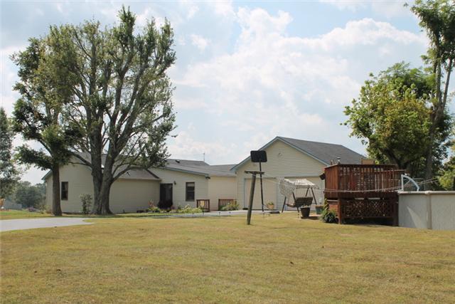 466 Howell Hill Road Kelso, TN 37348 - Photo 17 of 20 Side view of house, garage and pool