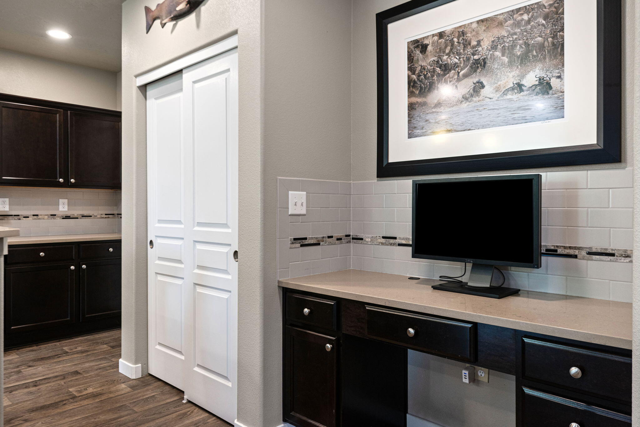 715 Brooks Camp Road Sisters, OR 97759 - Photo 9 of 25 a view of cabinets a sink and a painting on the wall