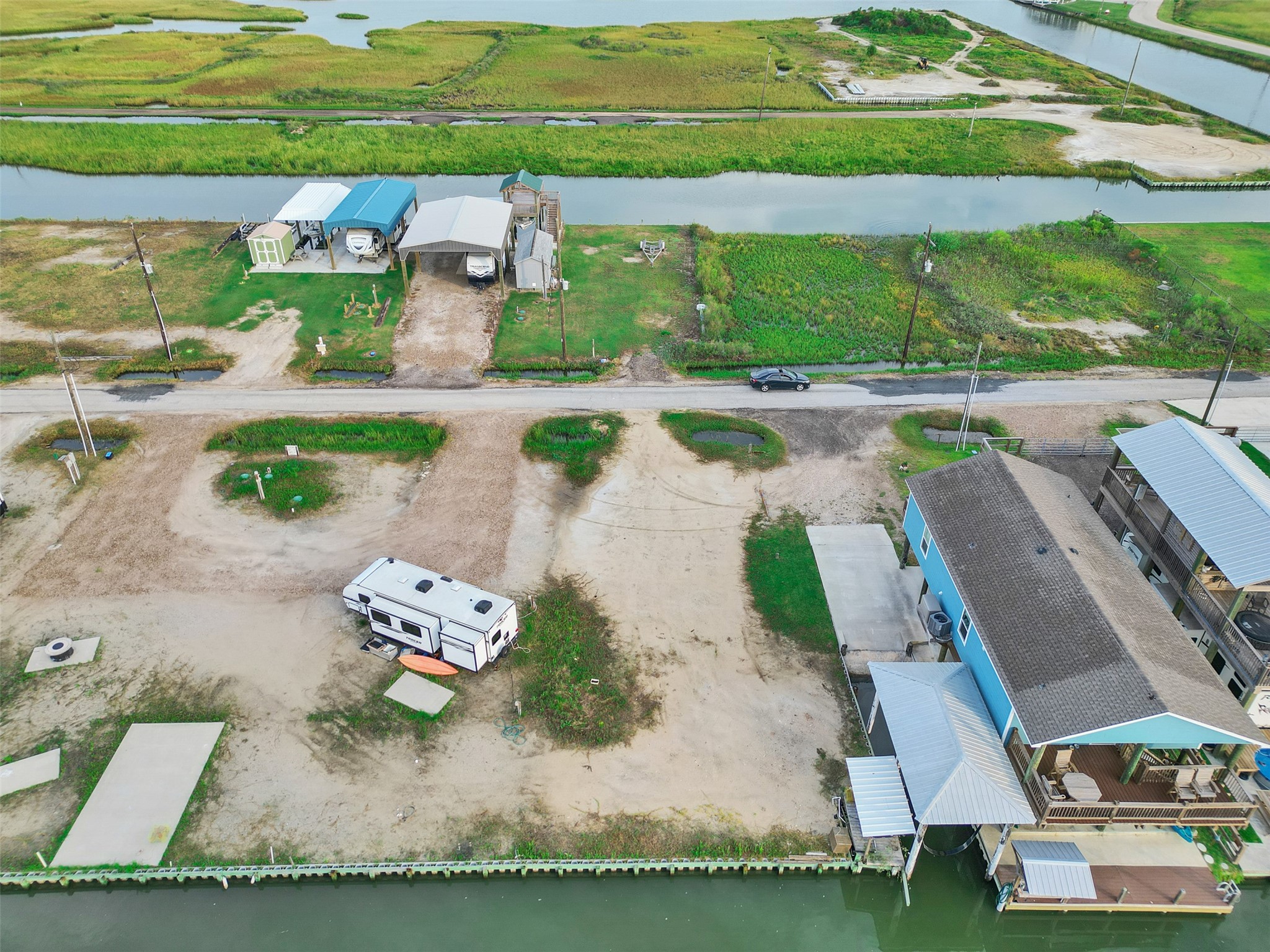 1120 Gator Point Port Bolivar, TX 77650 - Photo 4 of 8 an aerial view of a house with a yard basket ball court and outdoor seating