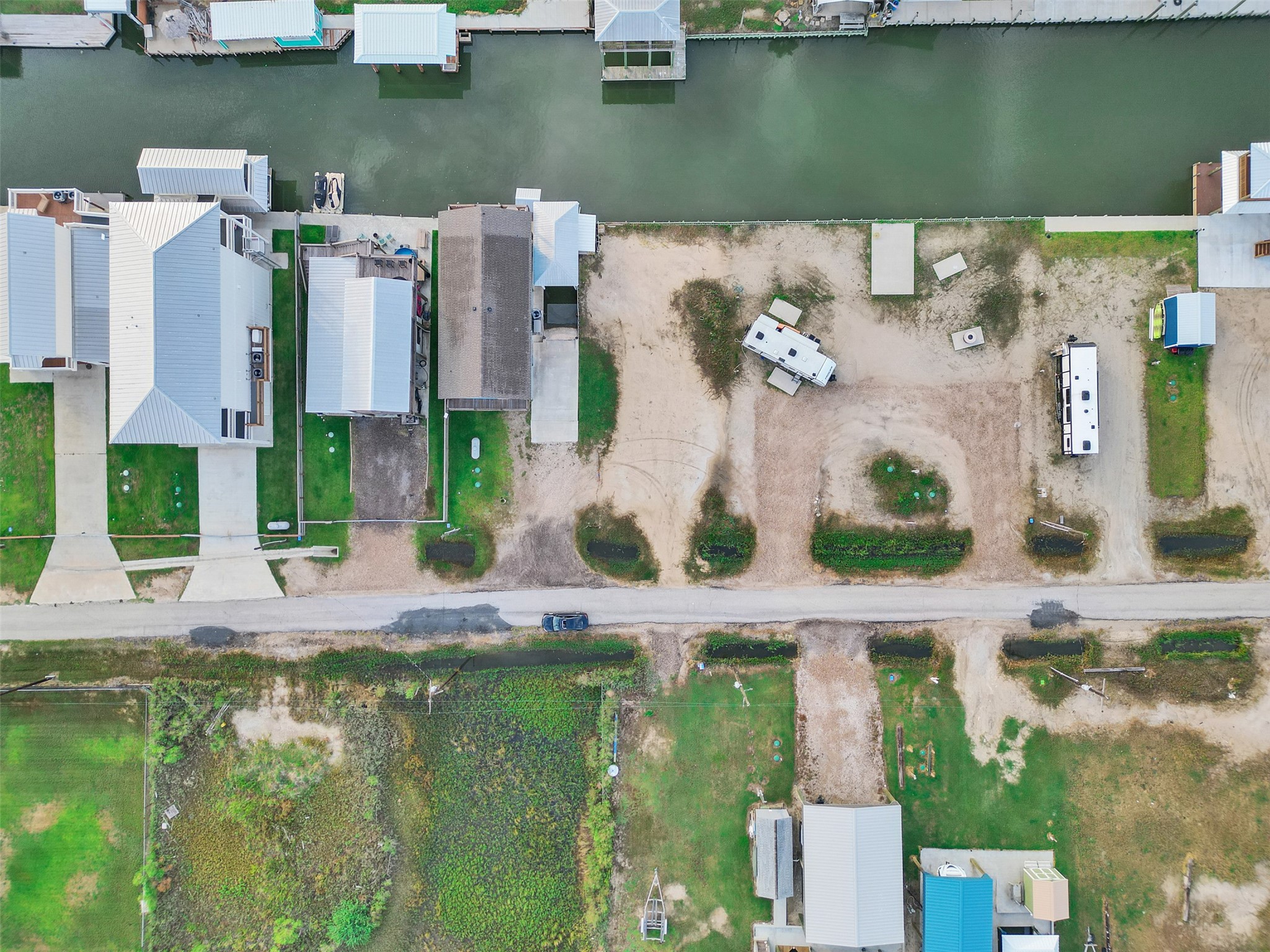 1120 Gator Point Port Bolivar, TX 77650 - Photo 6 of 8 an aerial view of a house with a lake view