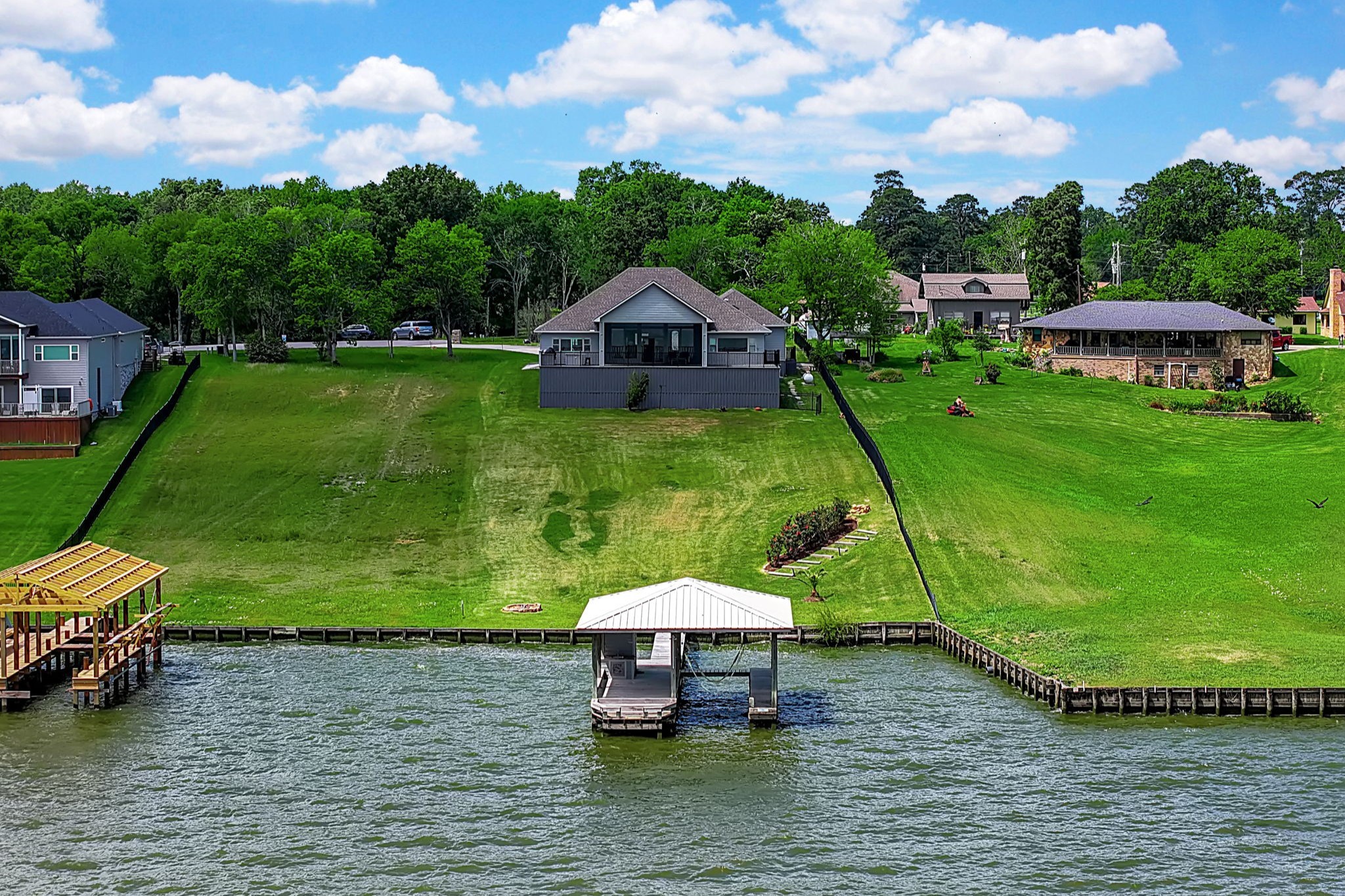 260 Legacy Blvd Point Point Blank, TX 77364 - Photo 2 of 46 Located in Heritage Shores, this waterfront home sits on a 0.96 acre lot