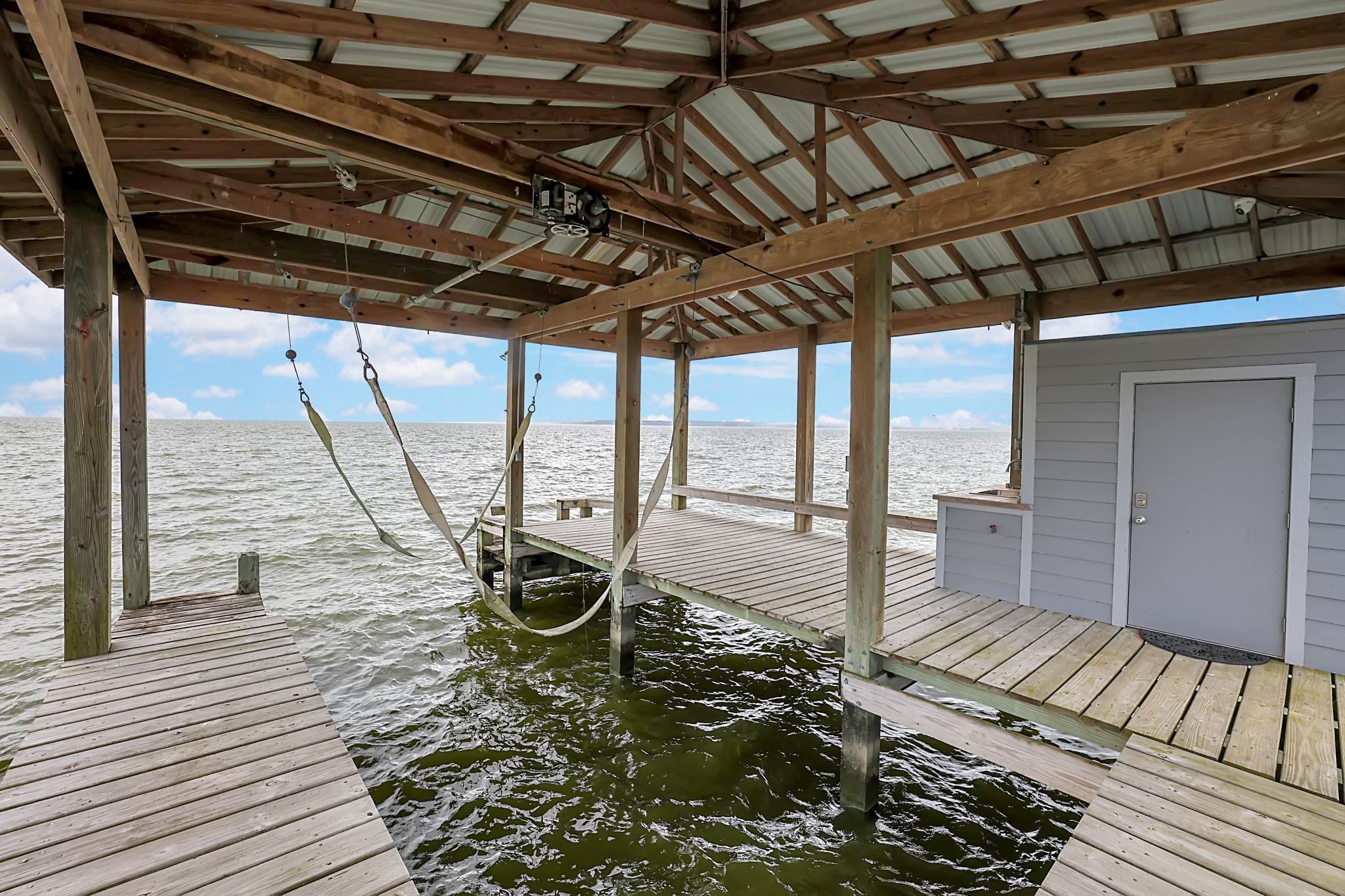 260 Legacy Blvd Point Point Blank, TX 77364 - Photo 40 of 46 The boathouse has room for your boat, a seating area and storage room