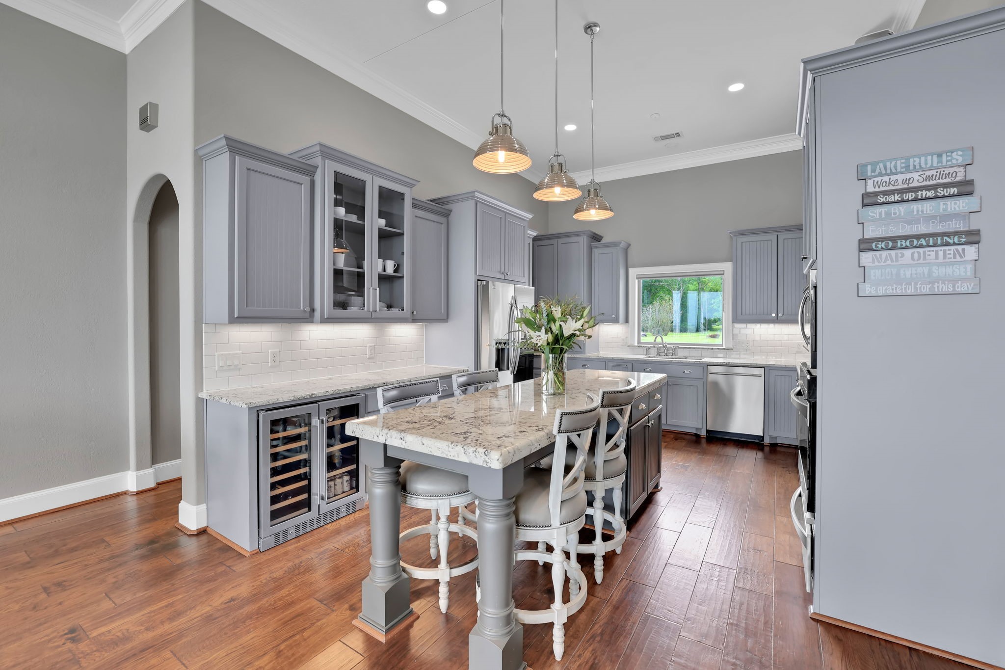 260 Legacy Blvd Point Point Blank, TX 77364 - Photo 9 of 46 The kitchen features an island with seating and custom cabinetry