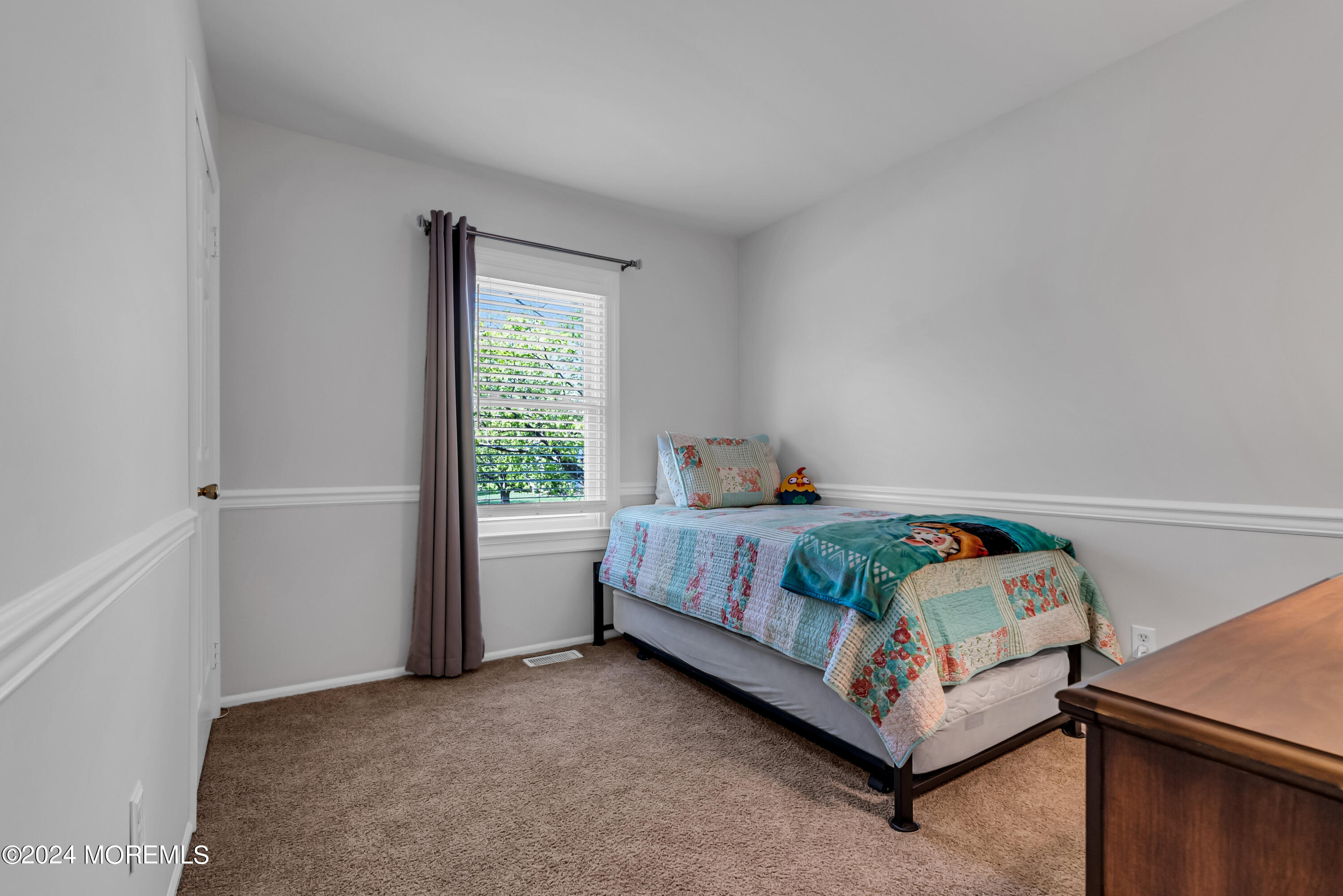 22 Oak Glen Road Toms River, NJ 08753 - Photo 11 of 25 a bed sitting in a bedroom next to a window