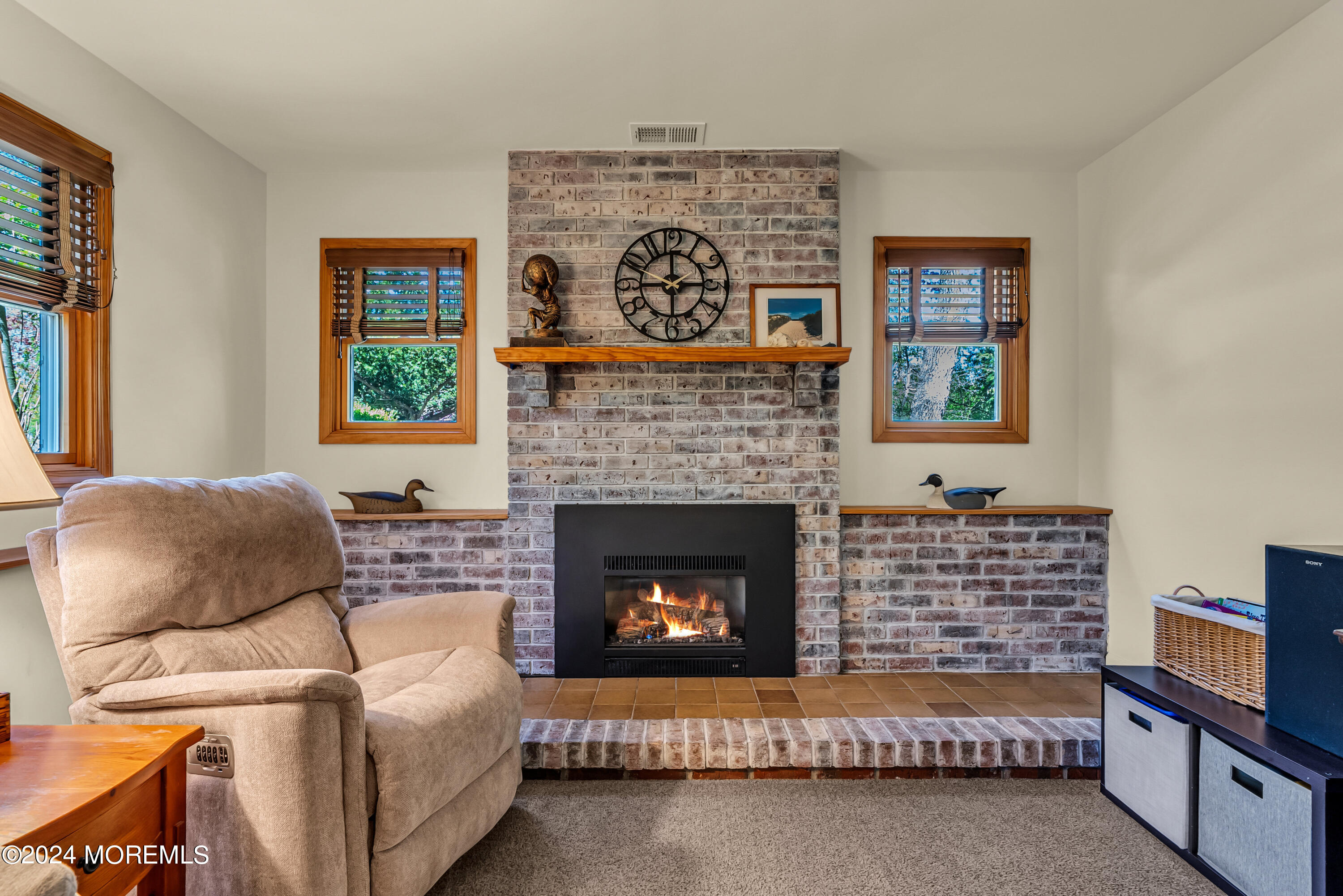 22 Oak Glen Road Toms River, NJ 08753 - Photo 13 of 25 a living room with furniture and a fireplace