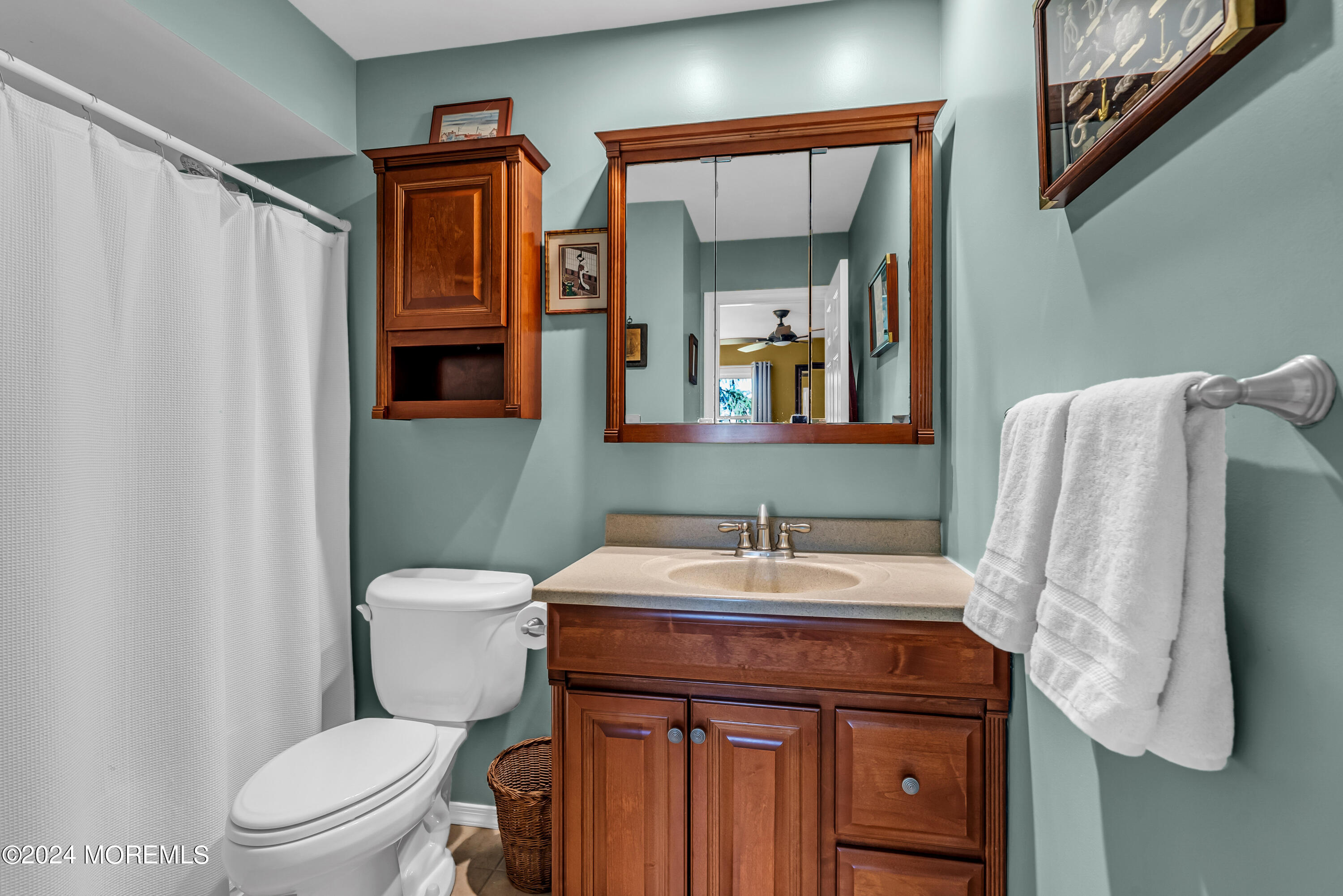 22 Oak Glen Road Toms River, NJ 08753 - Photo 16 of 25 a bathroom with a sink and a mirror