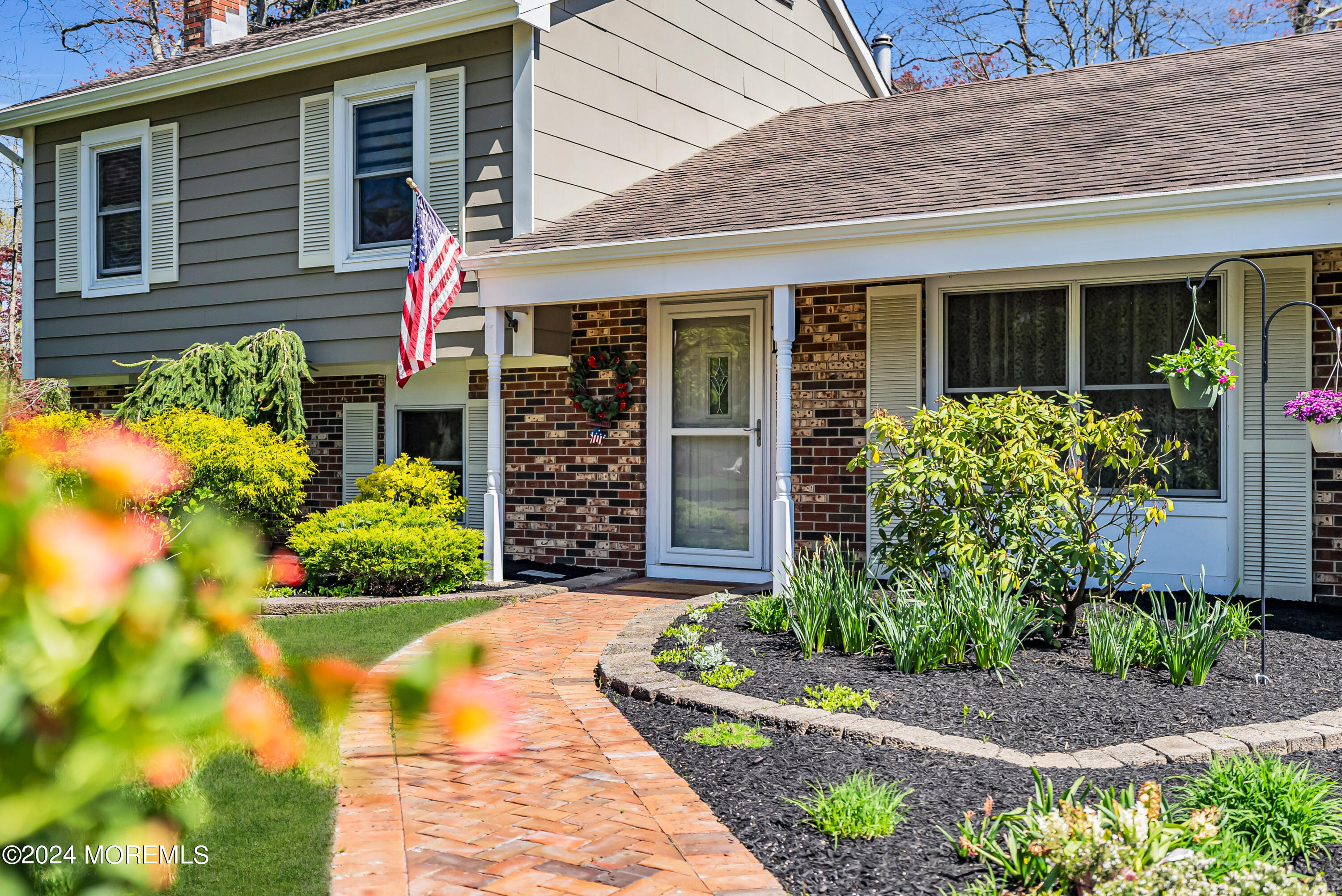 22 Oak Glen Road Toms River, NJ 08753 - Photo 2 of 25 a front view of a house with a yard and potted plants