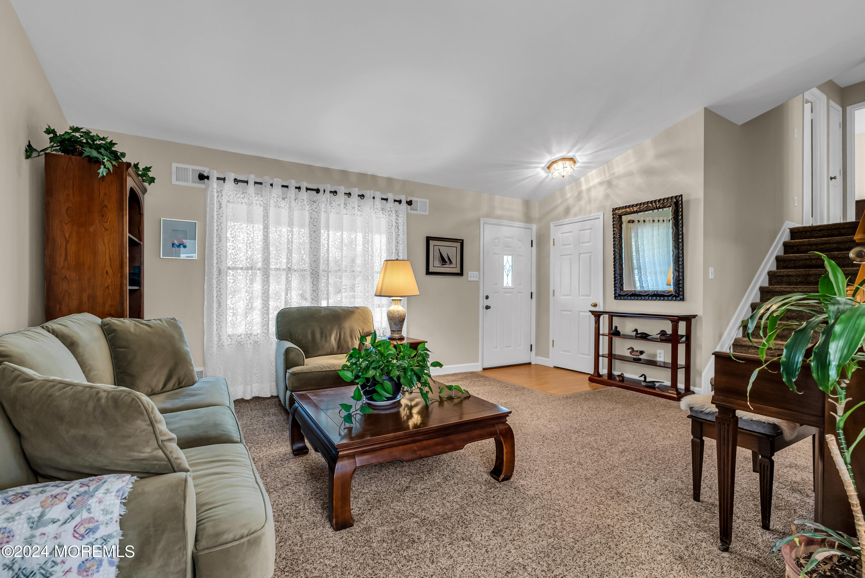 22 Oak Glen Road Toms River, NJ 08753 - Photo 8 of 25 a living room with furniture and a potted plant