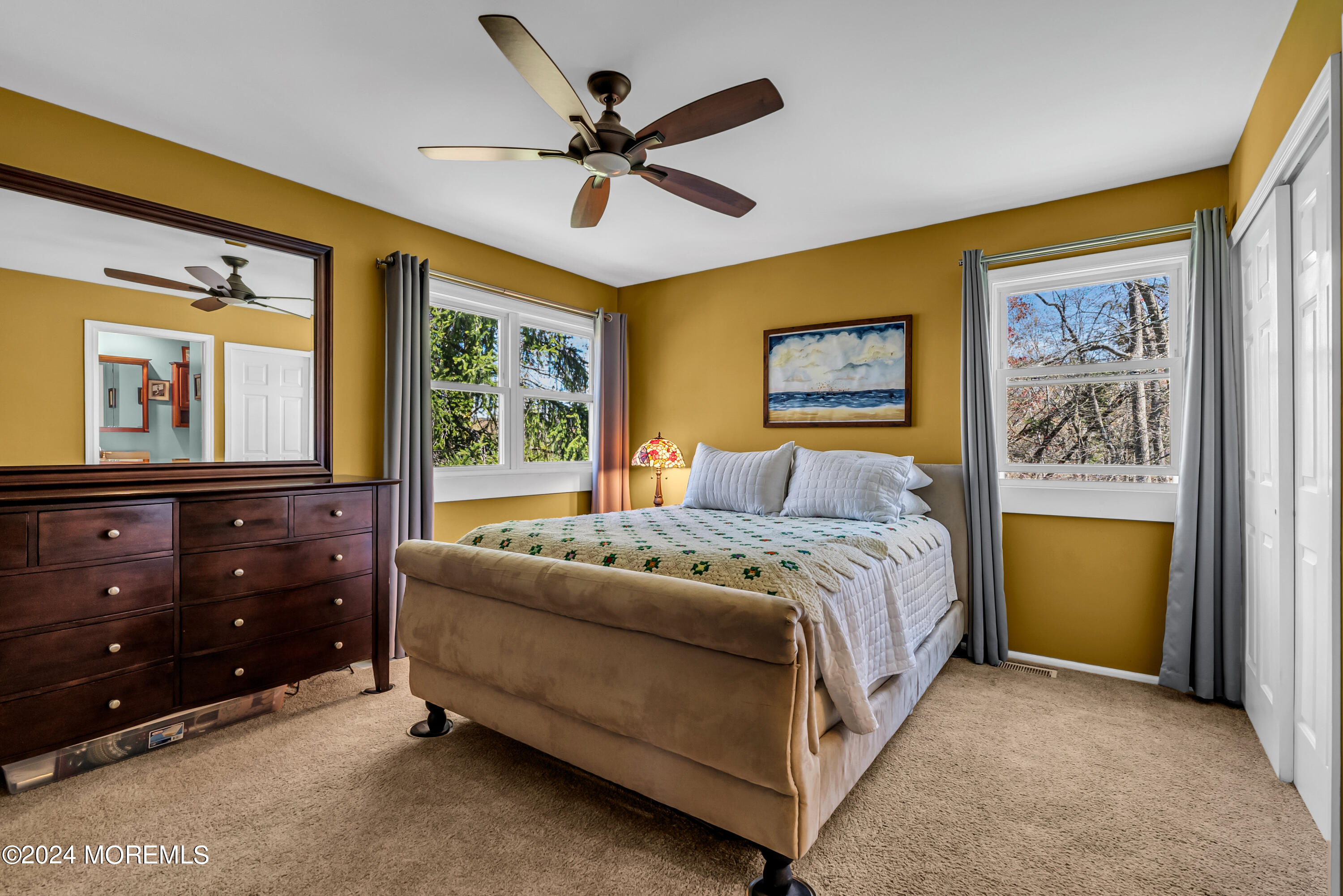 22 Oak Glen Road Toms River, NJ 08753 - Photo 9 of 25 a spacious bedroom with a bed and a dresser
