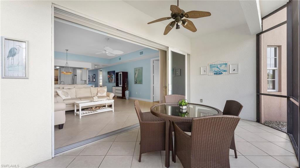7876 Hawthorne Drive, Unit 1202 Naples, FL 34113 - Photo 8 of 48 Dining space featuring ceiling fan and light tile patterned floors