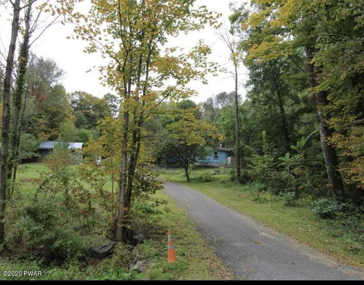 89 Sterling Gardens Road Moscow, PA 18444 - Photo 1 of 22 a view of a park with large trees