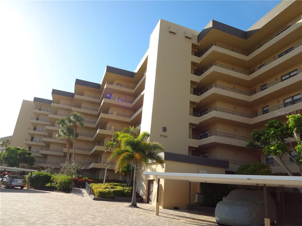 5780 Midnight Pass Road, Unit 701B Sarasota, FL 34242 - Photo 1 of 1 Building B view from Parking Lot