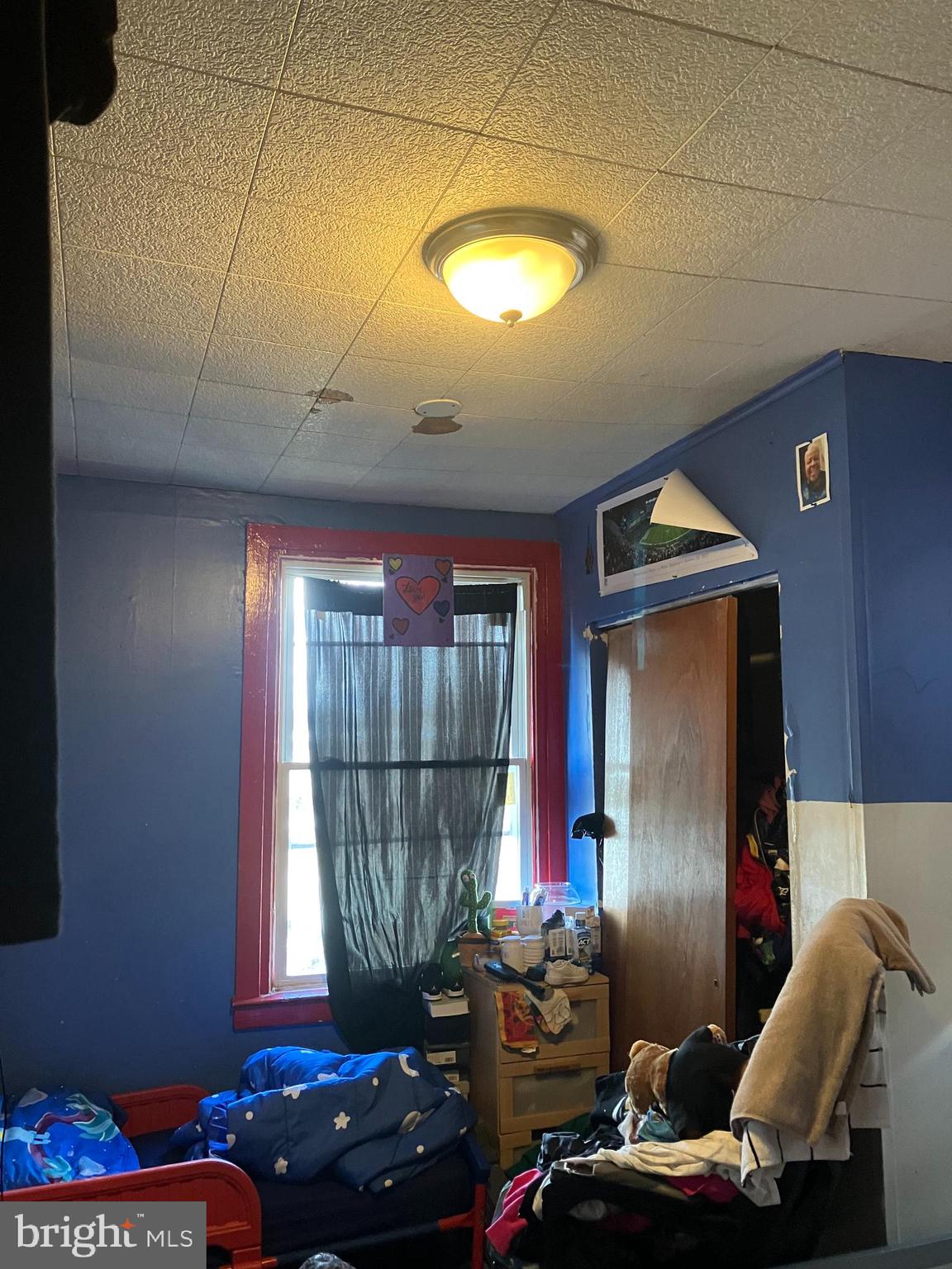 1623 Worrell Street Philadelphia, PA 19124 - Photo 16 of 17 a room with furniture and a window