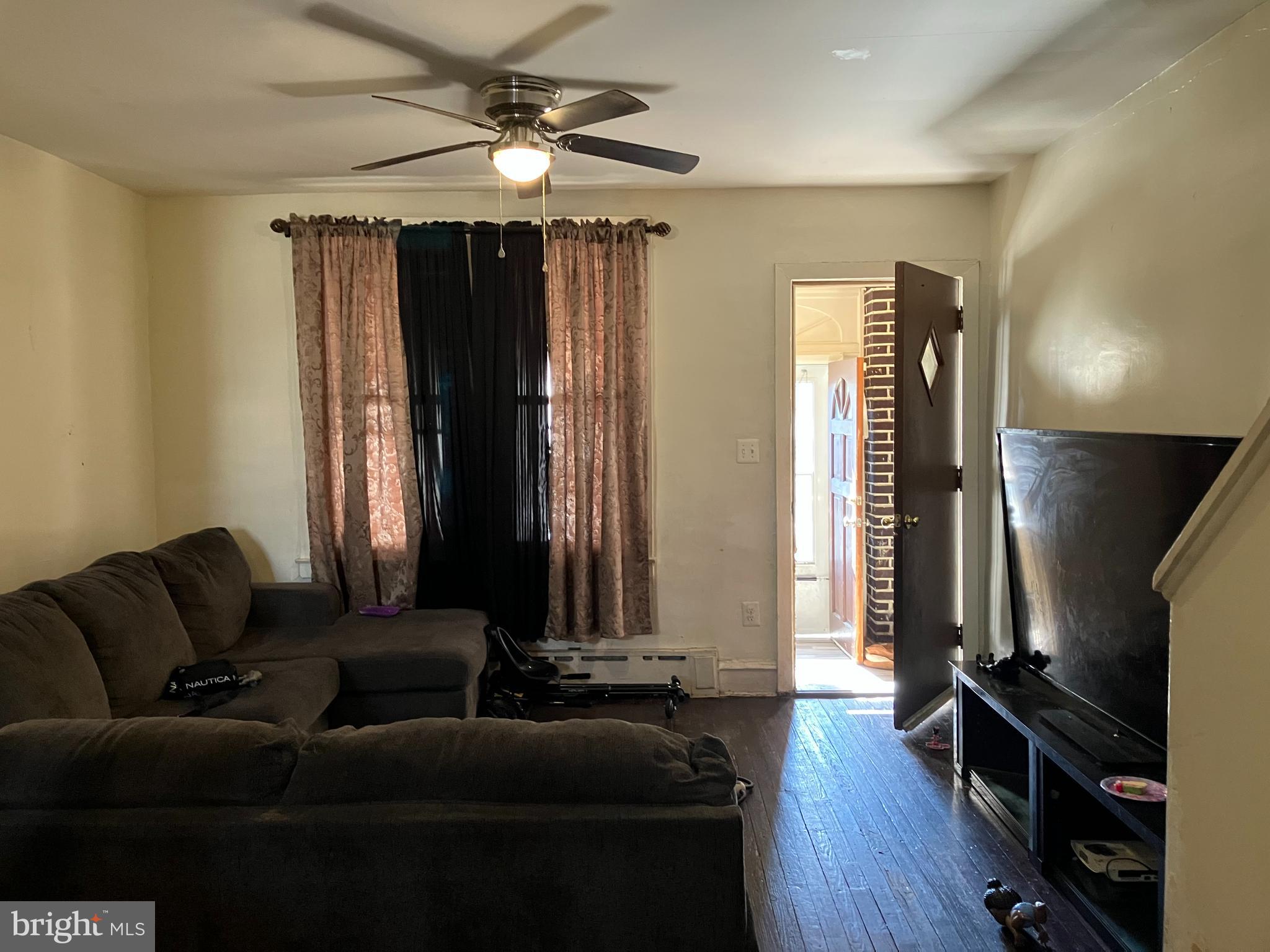 1623 Worrell Street Philadelphia, PA 19124 - Photo 10 of 17 a living room with furniture and a flat screen tv