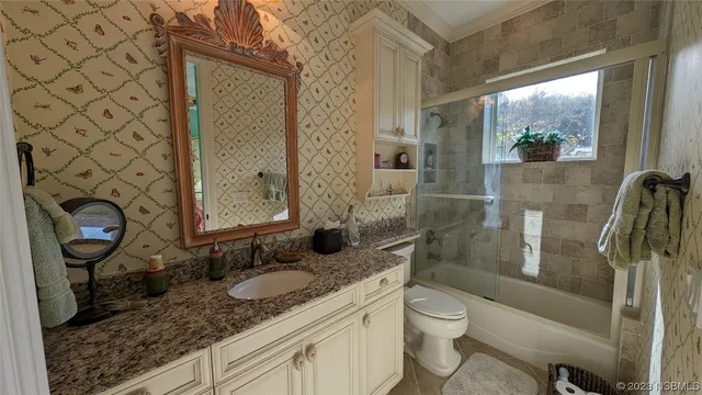a view of living room with furniture and a flat screen tv