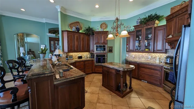 a kitchen with a stove top oven and cabinets