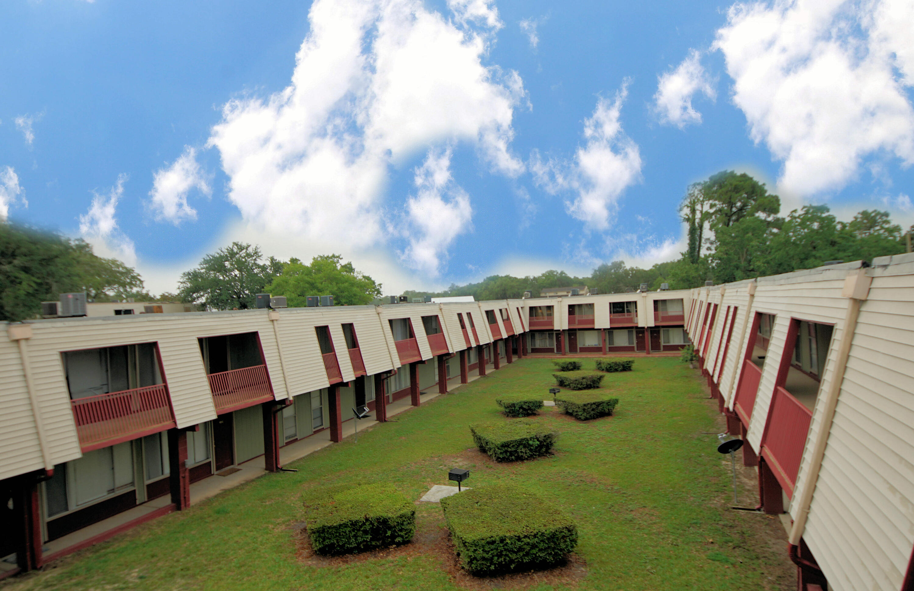 210 Pelham Road, Unit 219C Fort Walton Beach, FL 32547 - Photo 1 of 23 a view of yard with swimming pool and seating