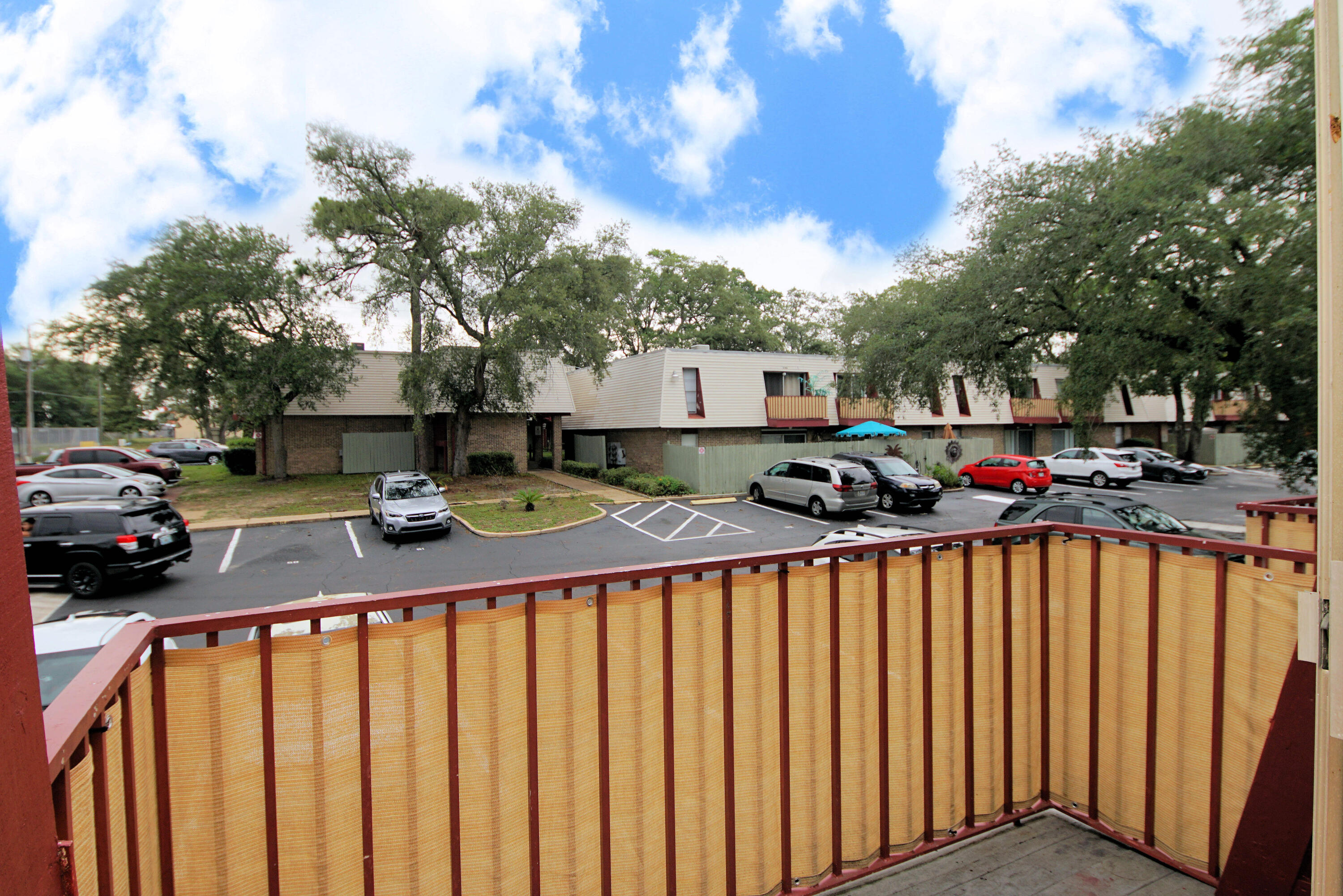210 Pelham Road, Unit 219C Fort Walton Beach, FL 32547 - Photo 19 of 23 a view of street with parked cars