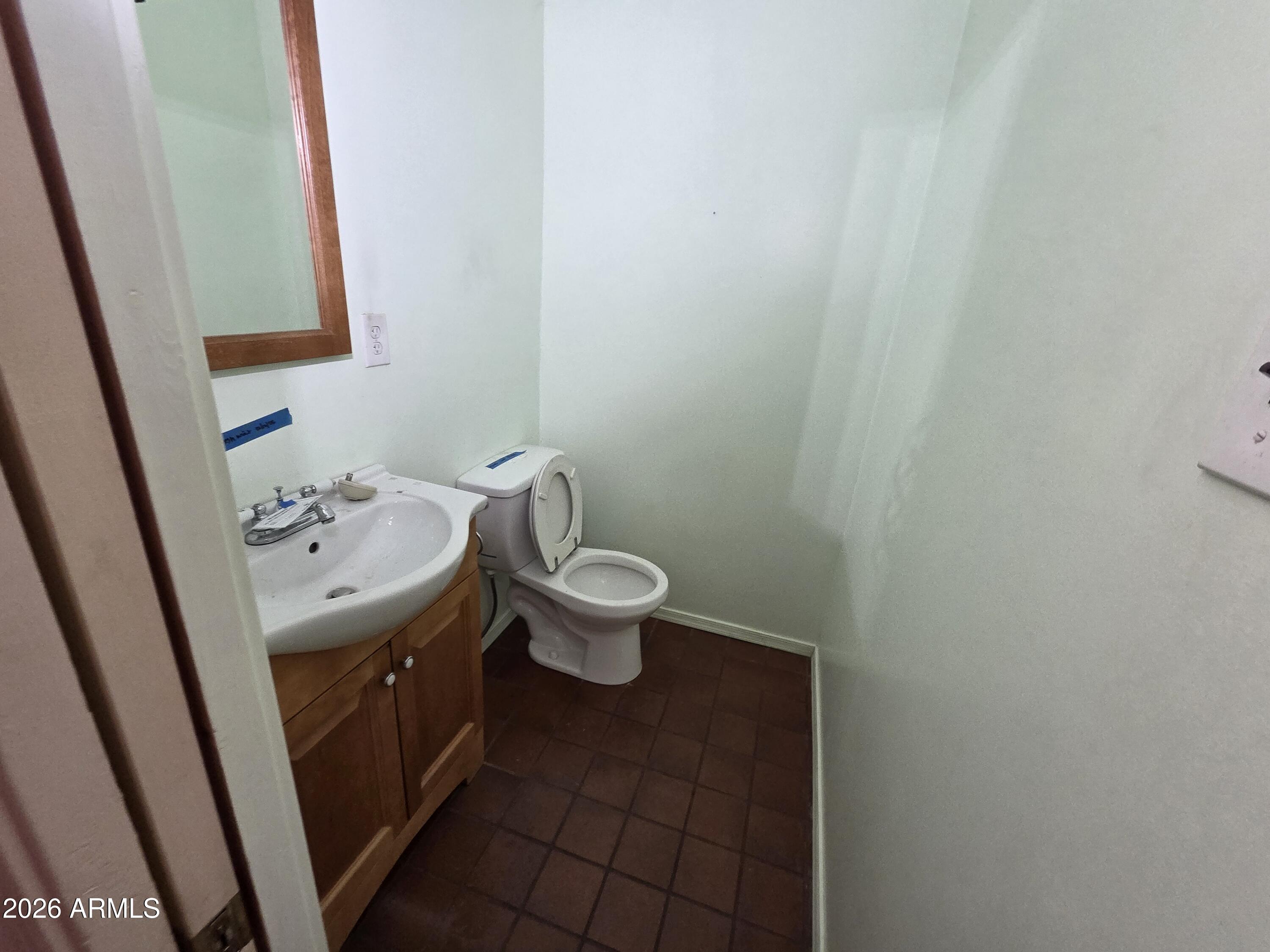 3237 West Pierce Street Phoenix, AZ 85009 - Photo 11 of 20 a bathroom with a sink and a mirror