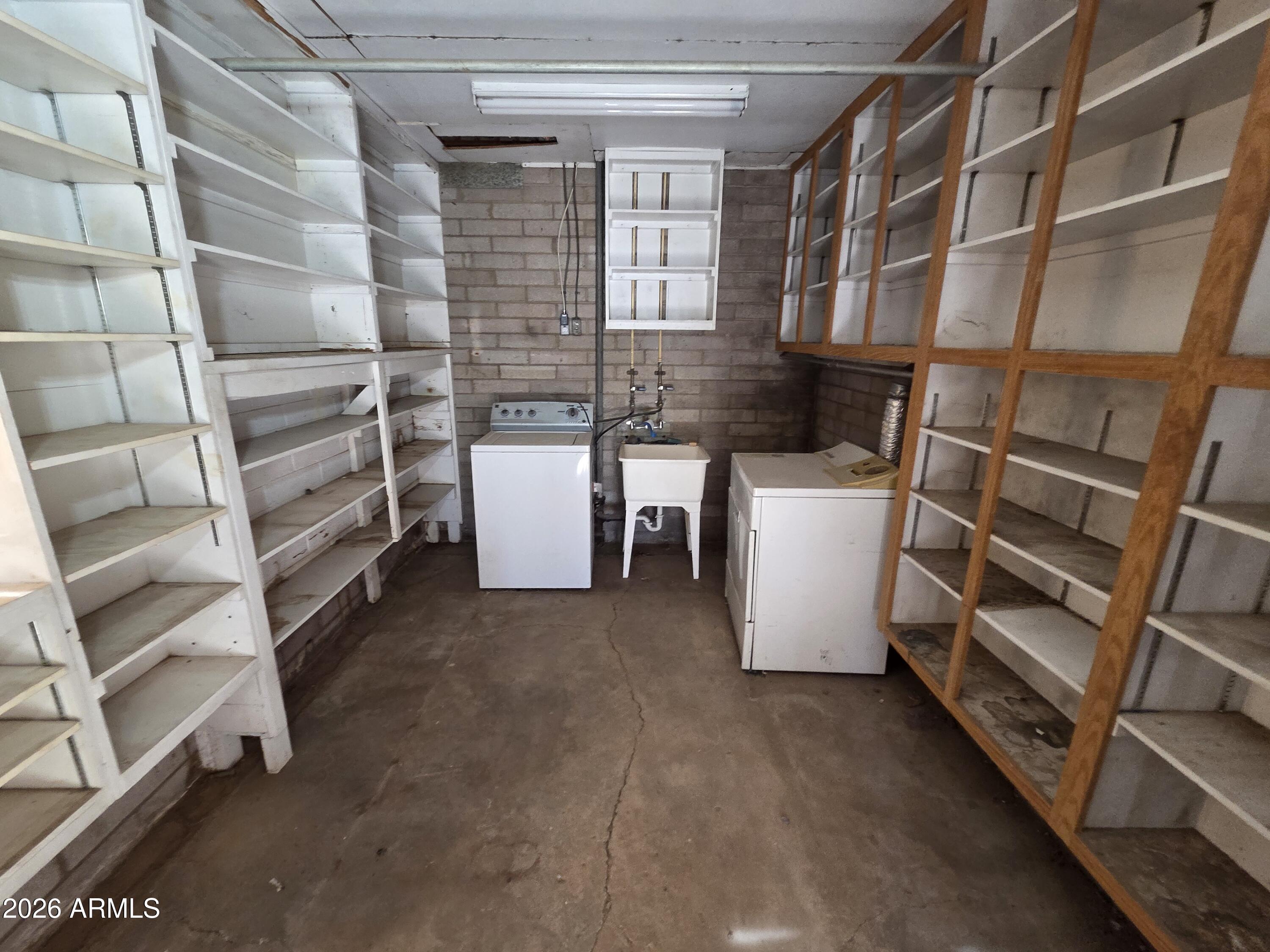 3237 West Pierce Street Phoenix, AZ 85009 - Photo 14 of 20 a view of a room with racks on the wall