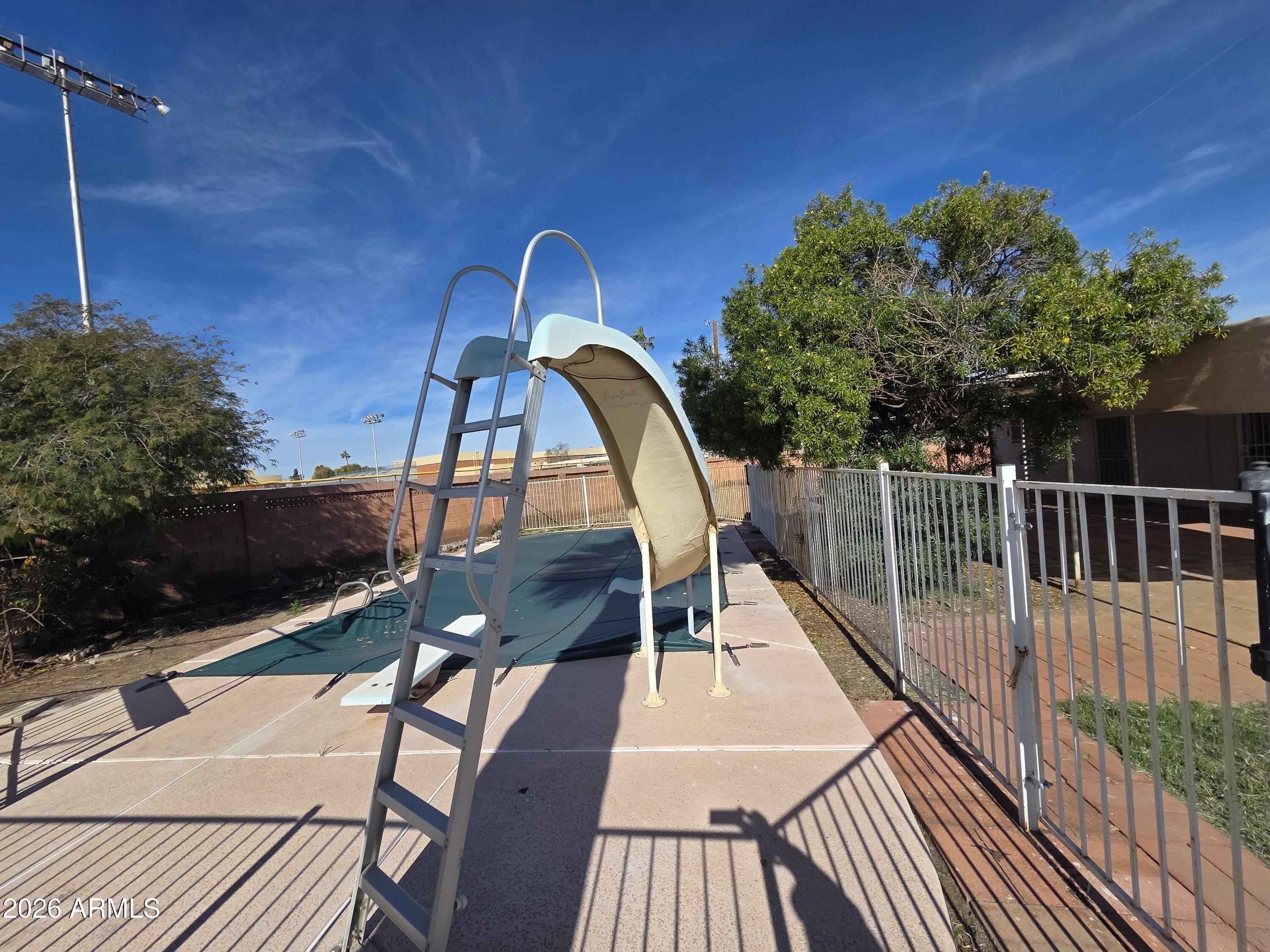 3237 West Pierce Street Phoenix, AZ 85009 - Photo 16 of 20 a view of balcony with wooden floor and outdoor seating